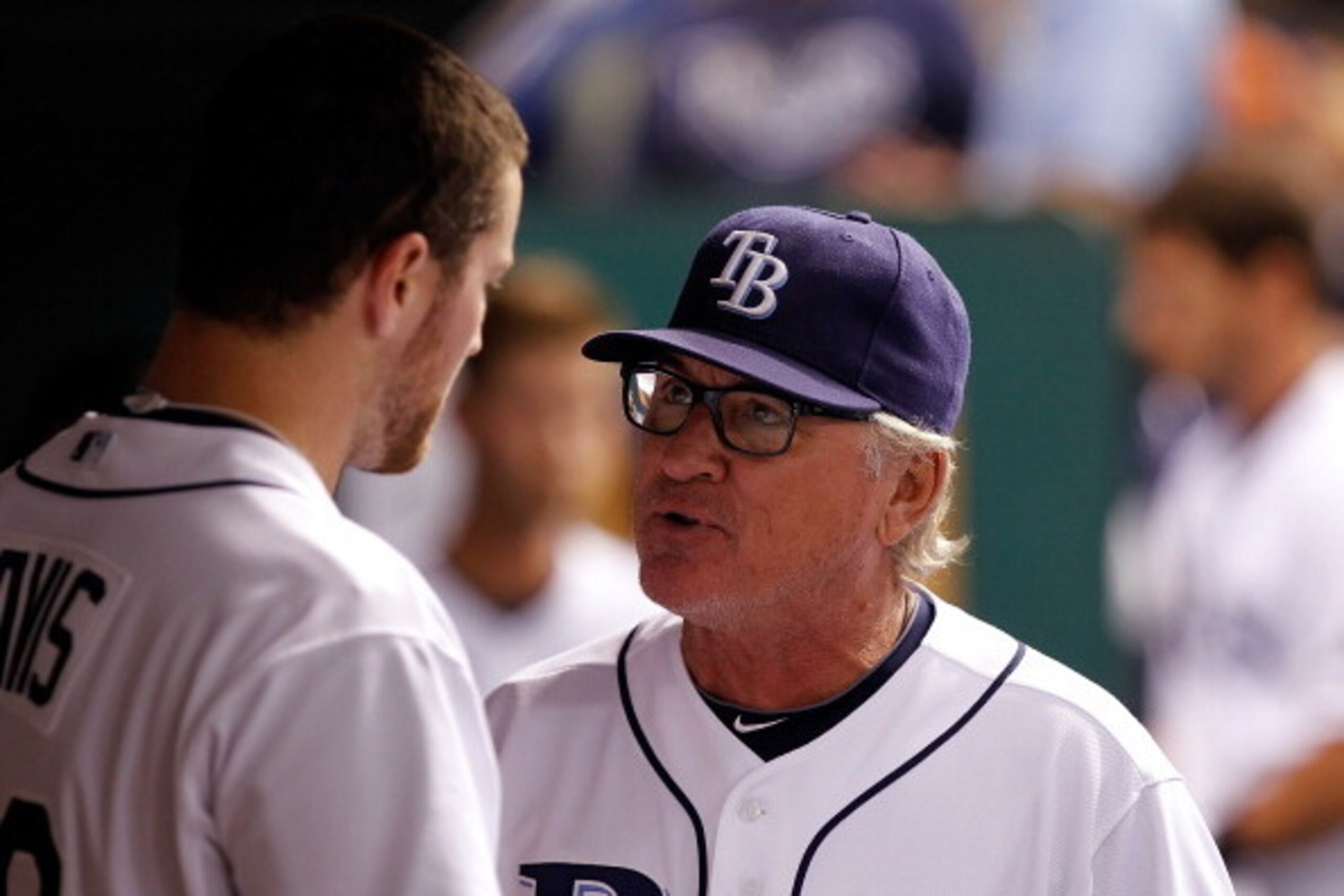 ST. PETERSBURG, FL - JULY 01:  Manager Joe Maddon #70 of the Tampa Bay Rays talks with pitcher Wade Davis #40 during the game against the St. Louis Cardinals at Tropicana Field on July 1, 2011 in St. Petersburg, Florida.  (Photo by J. Meric/Getty Images)