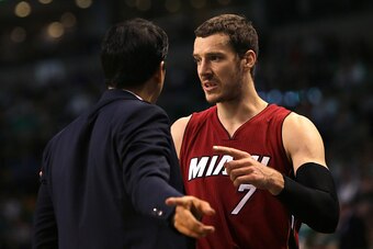 BOSTON, MA - APRIL 13: Goran Dragic #7 of the Miami Heat speaks to head coach Erik Spoelstra on the sidelines in the third quarter against the Boston Celtics at TD Garden on April 13, 2016 in Boston, Massachusetts. NOTE TO USER: User expressly acknowledge