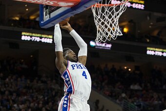 PHILADELPHIA, PA - MARCH 18: Nerlens Noel #4 of the Philadelphia 76ers dunks the ball against Steven Adams #12 of the Oklahoma City Thunder on March 18, 2016 at the Wells Fargo Center in Philadelphia, Pennsylvania. The Thunder defeated the 76ers 111-97. N
