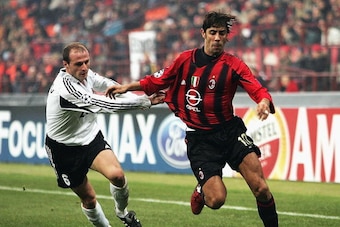 MILAN, ITALY - NOVEMBER 24:  Manuel Rui Costa of AC Milan is held back by Igor Duljaj of Shakhtar Donetsk to score during the UEFA Champions League Group F match between AC Milan and Shakhtar Donetsk at the San Siro on November 24, 2004 in Milan, Italy.  