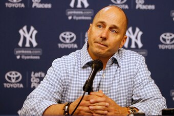 NEW YORK, NY - AUGUST 01: Brian Cashman, general manager of the New York Yankees, talks during a press conference before a game against the New York Mets at Citi Field on August 1, 2016 in the Flushing neighborhood of the Queens borough of New York City. 