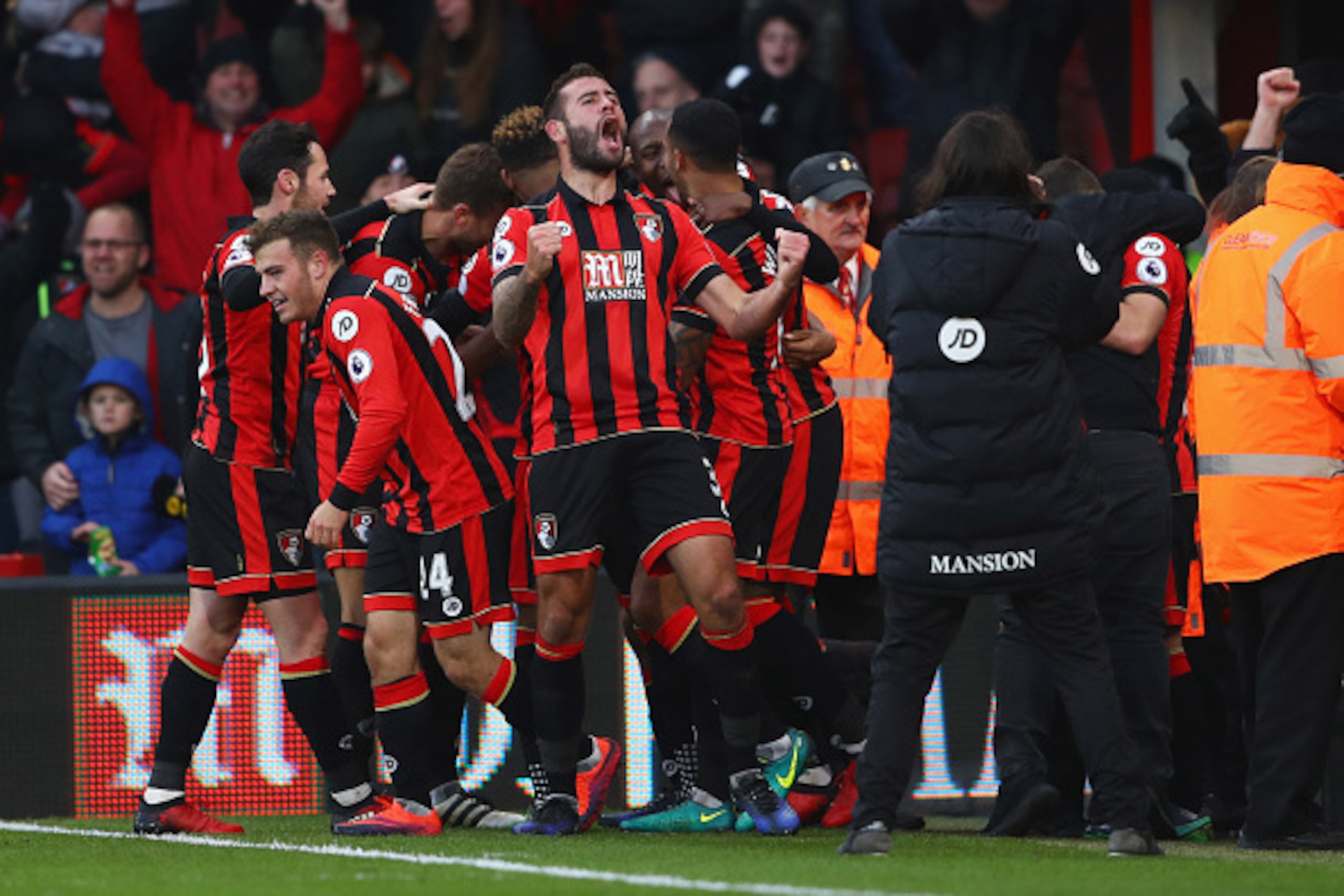 BOURNEMOUTH, ENGLAND - DECEMBER 04:  Steve Cook of AFC Bournemouth (3) celebrates with team mates as Nathan Ake of AFC Bournemouth scores their fourth goal during the Premier League match between AFC Bournemouth and Liverpool at Vitality Stadium on Decemb