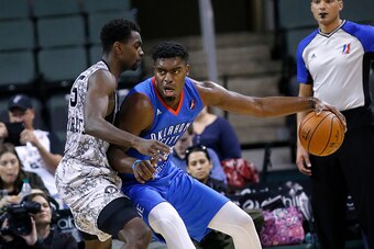 CEDAR PARK, TX - NOVEMBER 13: Dakari Johnson #44 of the Oklahoma City Blue drives around Livio Jean-Charles #35 of the Austin Spurs at the HEB Center At Cedar Park on November 13, 2016 in Cedar Park, Texas. NOTE TO USER: User expressly acknowledges and ag