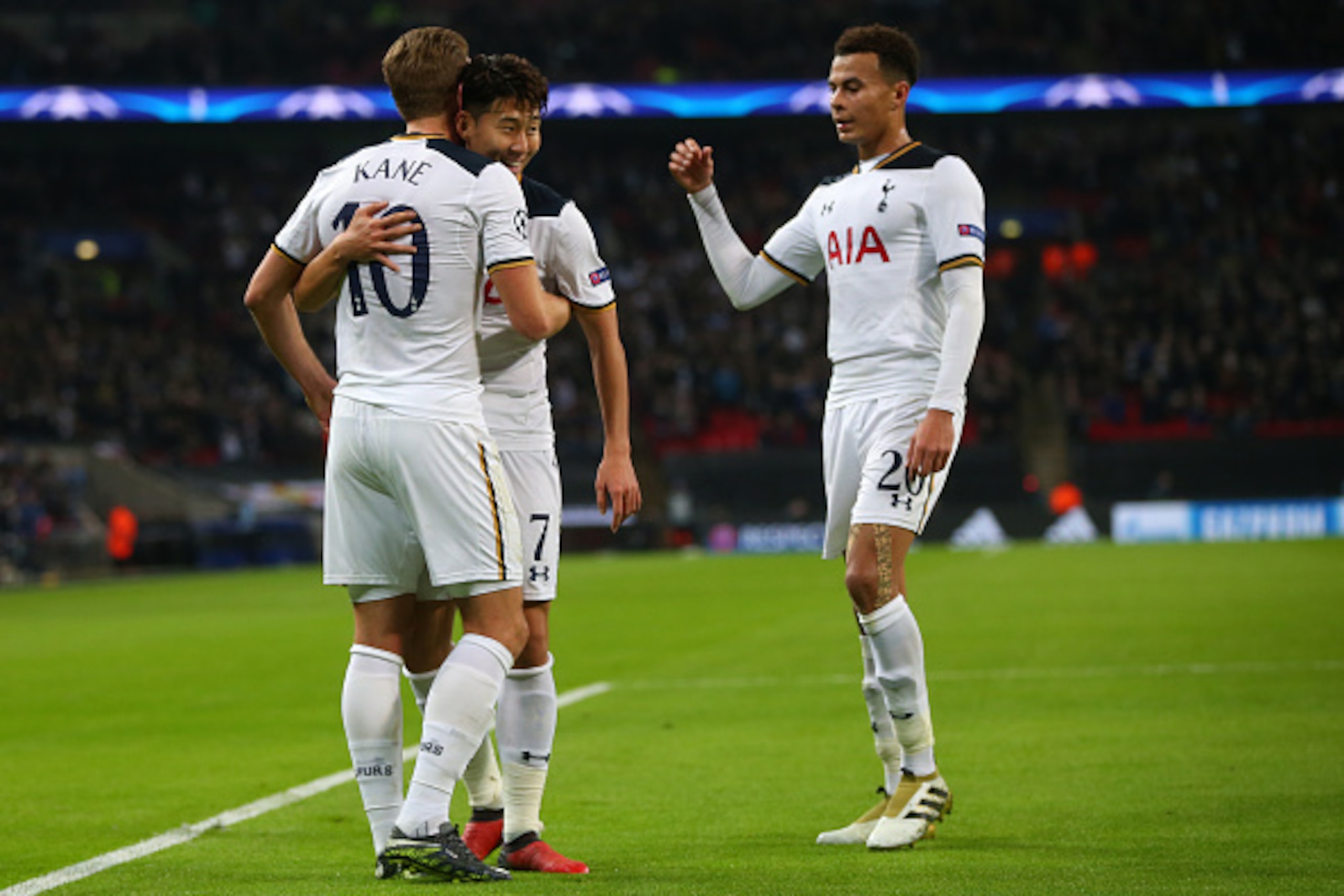 LONDON, ENGLAND - DECEMBER 07: Son Heung-min and Dele Alli of Tottenham Hotspur congratulate Harry Kane of Tottenham Hotspur after he scores to make it 2-1 during the UEFA Champions League match between Tottenham Hotspur FC and PFC CSKA Moskva at Wembley 