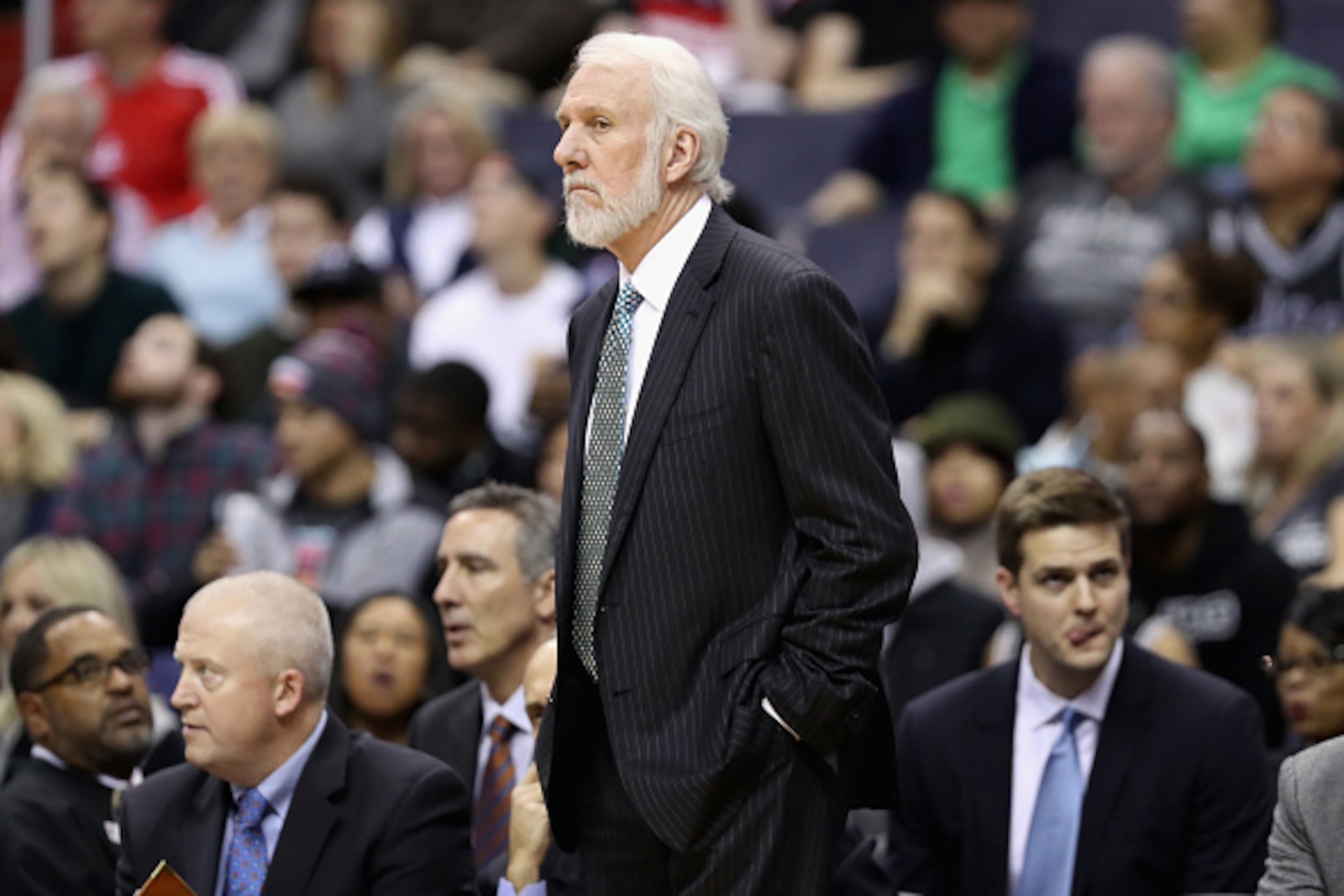 WASHINGTON, DC - NOVEMBER 26: Head coach Gregg Popovich of the San Antonio Spurs looks on against the Washington Wizards at Verizon Center on November 26, 2016 in Washington, DC. NOTE TO USER: User expressly acknowledges and agrees that, by downloading a WASHINGTON, DC - NOVEMBER 26: Head coach Gregg Popovich of the San Antonio Spurs looks on against the Washington Wizards at Verizon Center on November 26, 2016 in Washington, DC. NOTE TO USER: User expressly acknowledges and agrees that, by downloading a