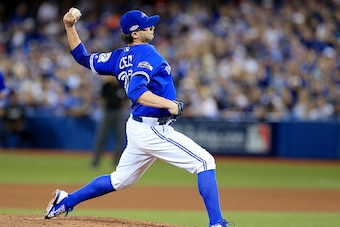 TORONTO, ON - OCTOBER 19:  Brett Cecil #27 of the Toronto Blue Jays throws a pitch in the seventh inning against the Cleveland Indians during game five of the American League Championship Series at Rogers Centre on October 19, 2016 in Toronto, Canada.  (P