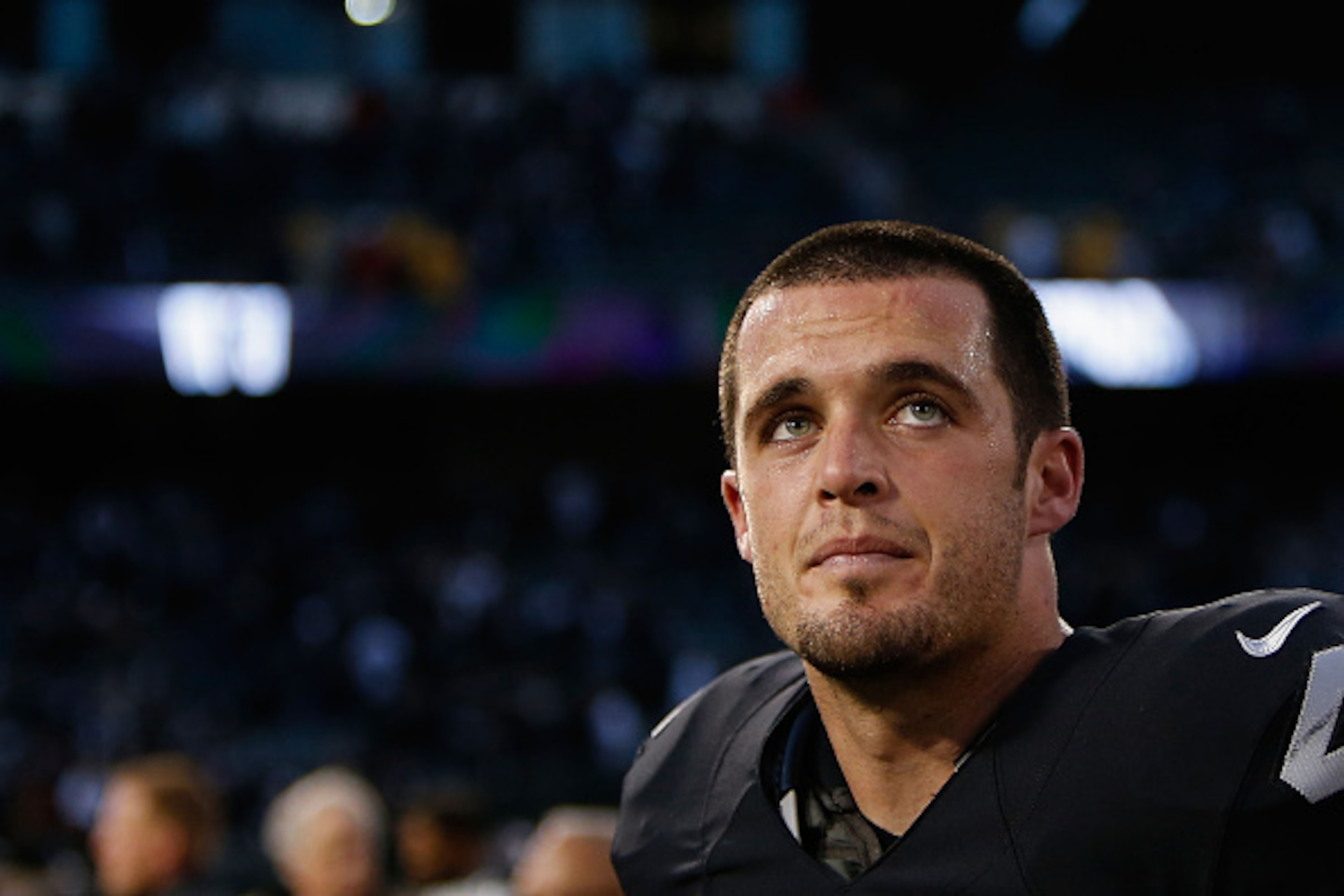 OAKLAND, CA - NOVEMBER 27: Derek Carr #4 of the Oakland Raiders looks on after a win in the game against the Carolina Panthers on November 27, 2016 in Oakland, California. (Photo by Lachlan Cunningham/Getty Images)