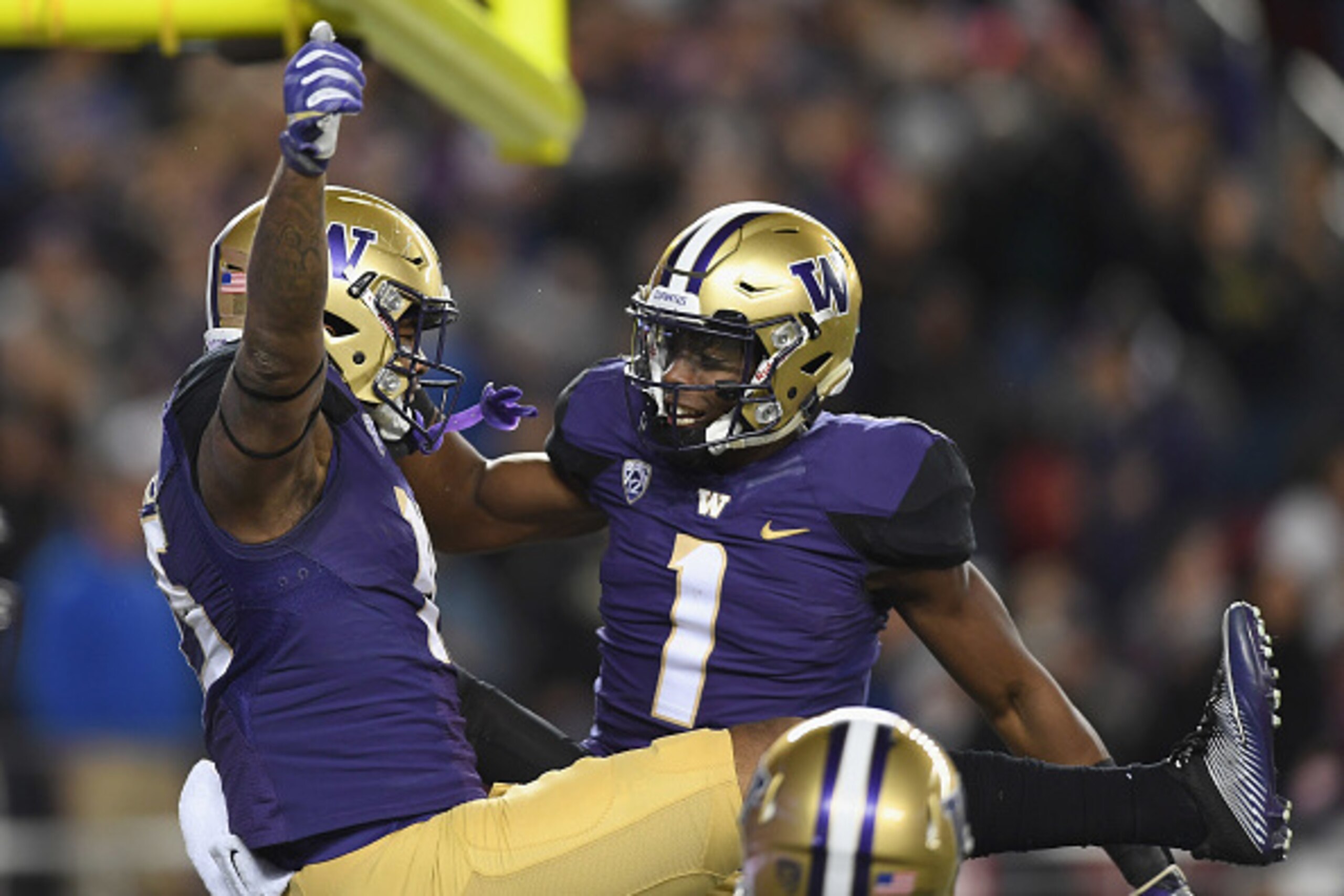 SANTA CLARA, CA - DECEMBER 02:  Darrell Daniels #15 of the Washington Huskies celebrates with John Ross #1 after Daniels scored a touchdown against the Colorado Buffaloes during the Pac-12 Championship game at Levi's Stadium on December 2, 2016 in Santa C