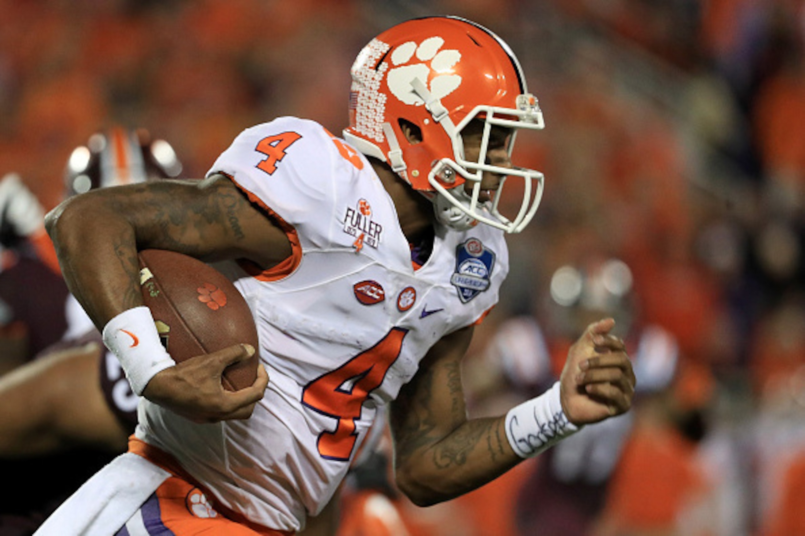 ORLANDO, FL - DECEMBER 03:  Deshaun Watson #4 of the Clemson Tigers rushes during the ACC Championship against the Virginia Tech Hokies on December 3, 2016 in Orlando, Florida.  (Photo by Mike Ehrmann/Getty Images)