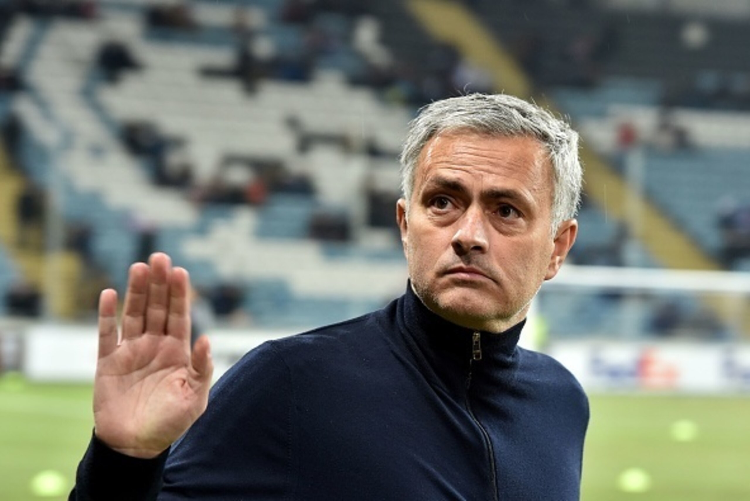 Manchester United FC coach Jose Mourinho greets the fans prior the UEFA Europa League football match between FC Zorya Luhansk and Manchester United FC at the Chornomorets stadium in Odessa on December 8, 2016. / AFP / SERGEI SUPINSKY        (Photo credit 