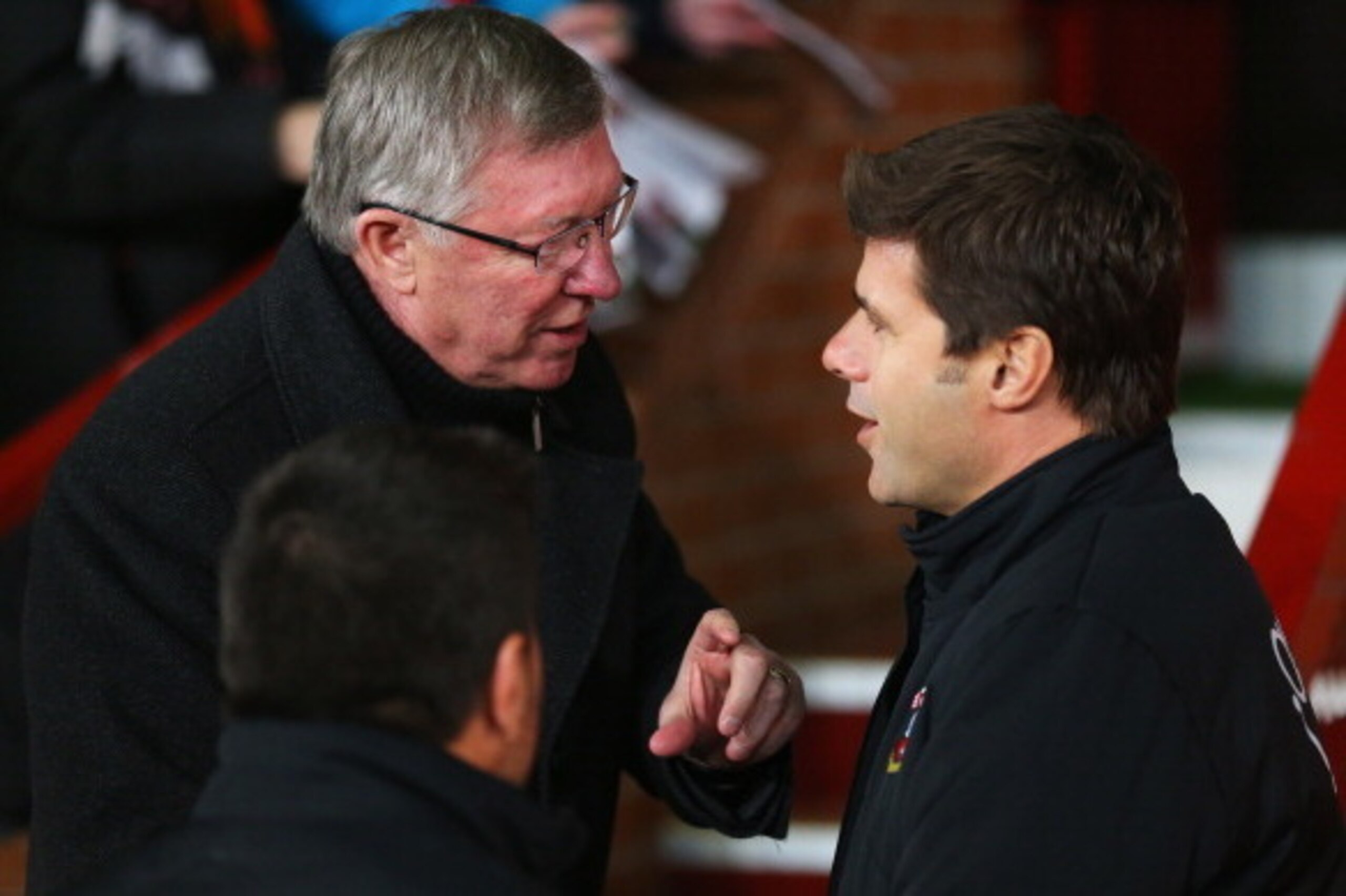 MANCHESTER, ENGLAND - JANUARY 30:  Sir Alex Ferguson manager of Manchester United talks to Mauricio Pochettino manager of Southampton prior to the Barclays Premier League match between Manchester United and Southampton at Old Trafford on January 30, 2013 