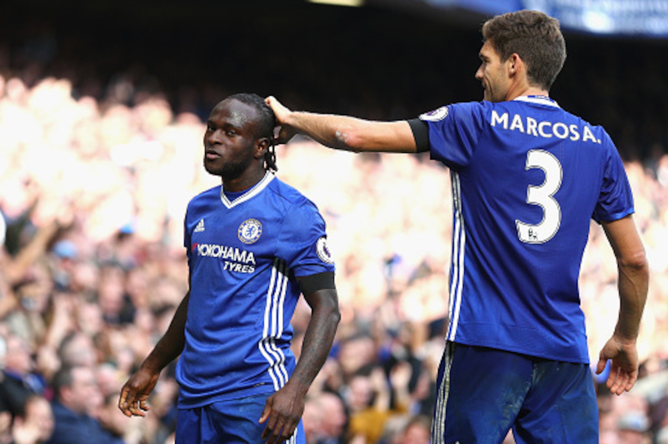 LONDON, ENGLAND - OCTOBER 15: Victor Moses of Chelsea (L) celebrates scoring his sides third goal with Marcos Alonso of Chelsea (R) during the Premier League match between Chelsea and Leicester City at Stamford Bridge on October 15, 2016 in London, Englan
