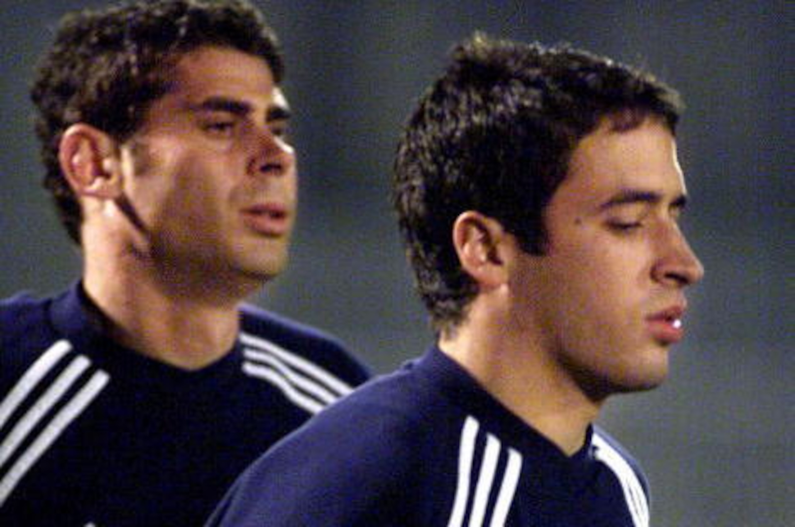 TOKYO, JAPAN: Spanish club team Real Madrid forward Raul Gonzalez (R) and captain Fernado Ruis Hierro (L) warm up in a practice session at Nishigaoka soccer ground in Tokyo, 25 November 2000. The European club champion will compete for the Intercontinent TOKYO, JAPAN: Spanish club team Real Madrid forward Raul Gonzalez (R) and captain Fernado Ruis Hierro (L) warm up in a practice session at Nishigaoka soccer ground in Tokyo, 25 November 2000. The European club champion will compete for the Intercontinent