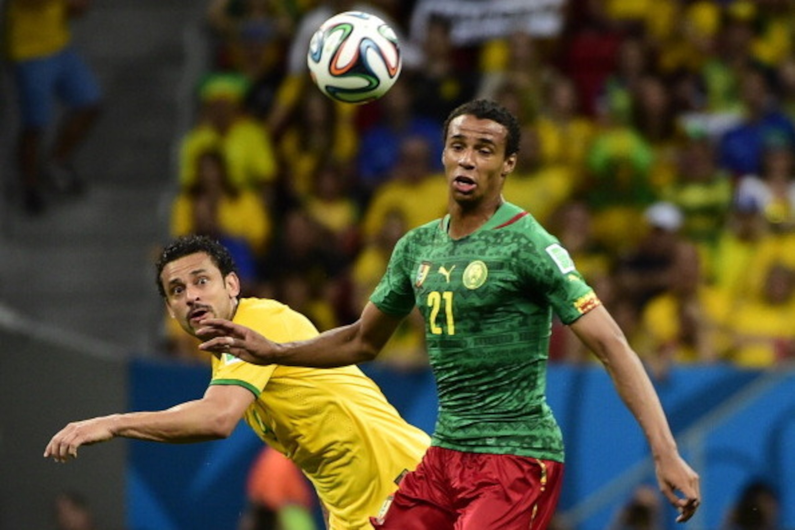 Cameroon's midfielder Joel Matip (R) vies with Brazil's forward Fred during a Group A football match between Cameroon and Brazil at the Mane Garrincha National Stadium in Brasilia during the 2014 FIFA World Cup on June 23, 2014. AFP PHOTO / PIERR Cameroon's midfielder Joel Matip (R) vies with Brazil's forward Fred during a Group A football match between Cameroon and Brazil at the Mane Garrincha National Stadium in Brasilia during the 2014 FIFA World Cup on June 23, 2014. AFP PHOTO / PIERR