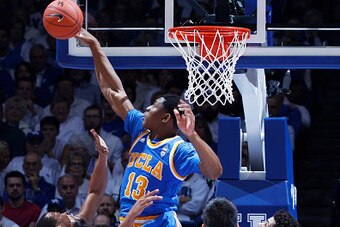 LEXINGTON, KY - DECEMBER 03: Ike Anigbogu #13 of the UCLA Bruins blocks a shot by Isaiah Briscoe #13 of the Kentucky Wildcats in the first half of the game at Rupp Arena on December 3, 2016 in Lexington, Kentucky. UCLA defeated Kentucky 97-92. (Photo by J