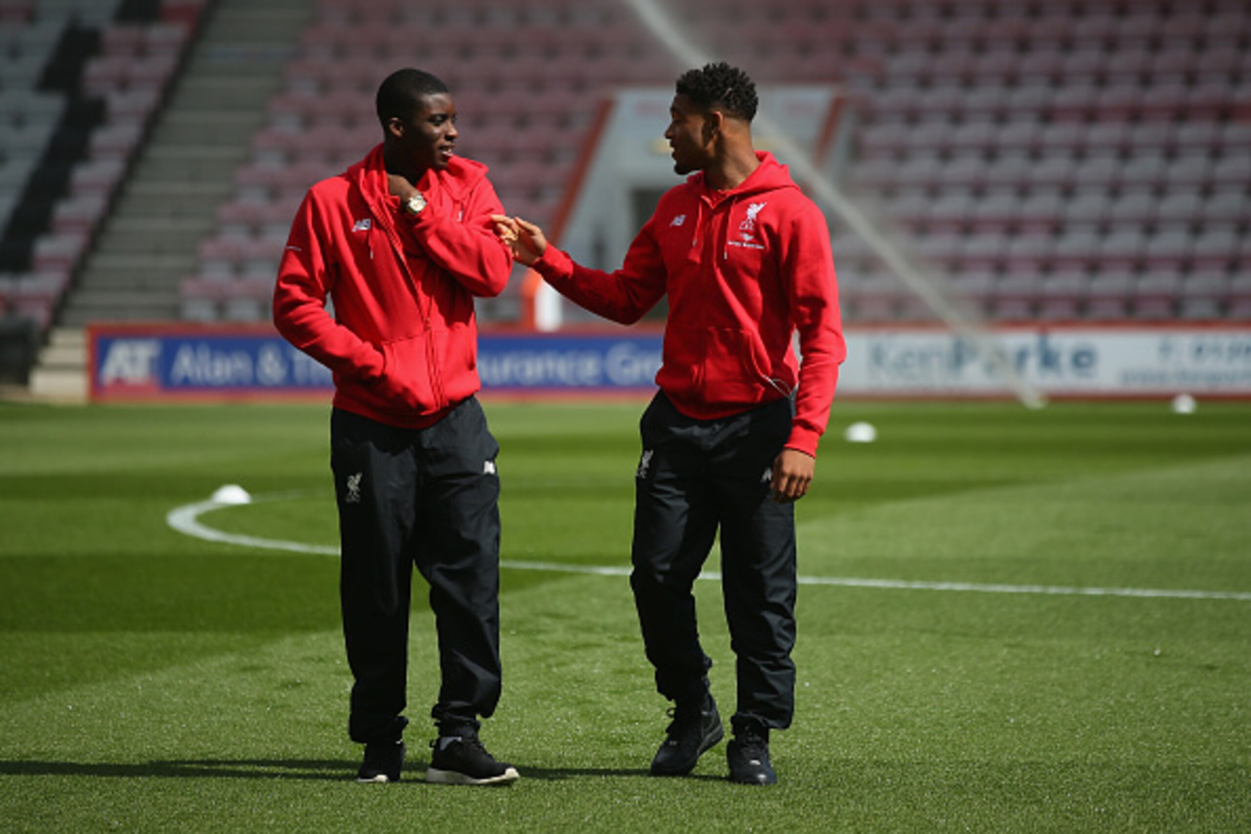 BOURNEMOUTH, ENGLAND - APRIL 17:  Sheyi Ojo of Liverpool speaks with team mate Jordan Ibe ahead of the Barclays Premier League match between A.F.C. Bournemouth and Liverpool at the Vitality Stadium on April 17, 2016 in Bournemouth, England.  (Photo by Bry