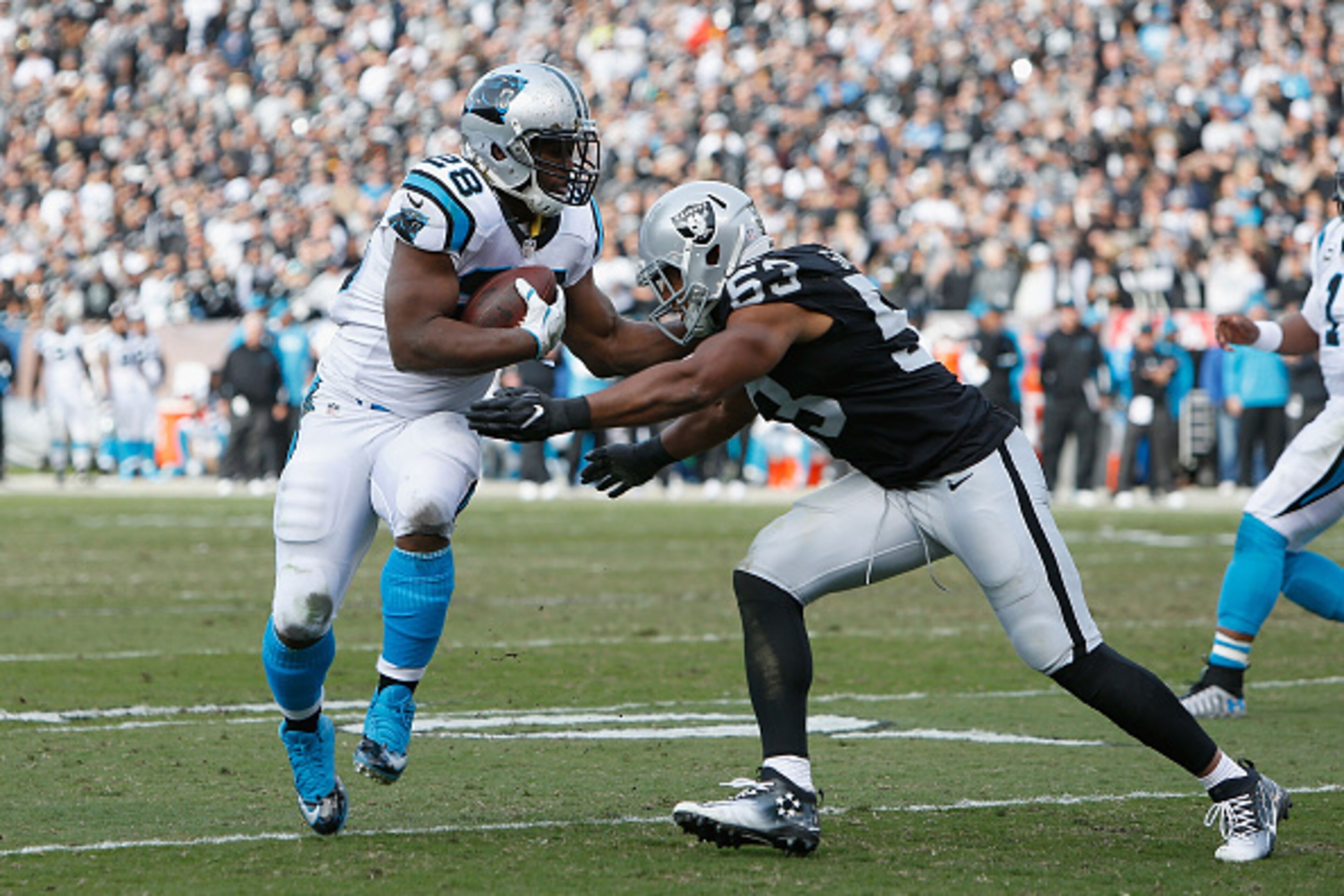 OAKLAND, CA - NOVEMBER 27: Jonathan Stewart #28 of the Carolina Panthers is hit by Malcolm Smith #53 of the Oakland Raiders on November 27, 2016 in Oakland, California. (Photo by Lachlan Cunningham/Getty Images) OAKLAND, CA - NOVEMBER 27: Jonathan Stewart #28 of the Carolina Panthers is hit by Malcolm Smith #53 of the Oakland Raiders on November 27, 2016 in Oakland, California. (Photo by Lachlan Cunningham/Getty Images)