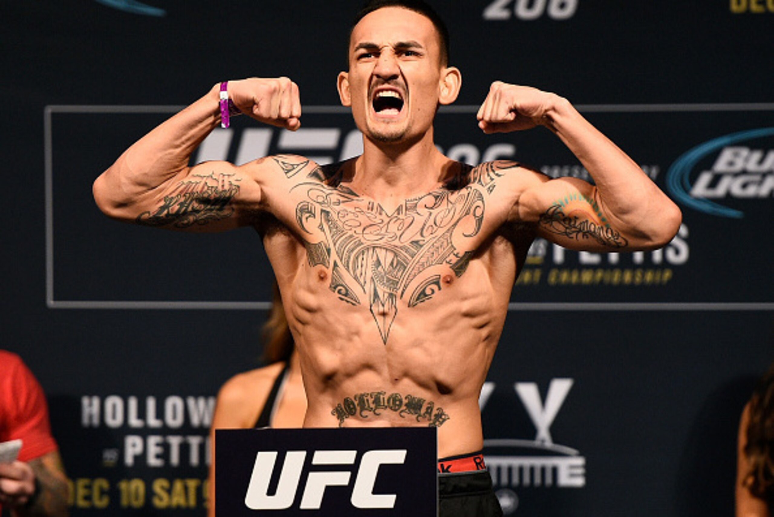 TORONTO, CANADA - DECEMBER 09:  Max Holloway poses on the scale during the UFC weigh-in at Air Canada Centre on December 9, 2016 in Toronto, Ontario, Canada. (Photo by Jeff Bottari/Zuffa LLC/Zuffa LLC via Getty Images)