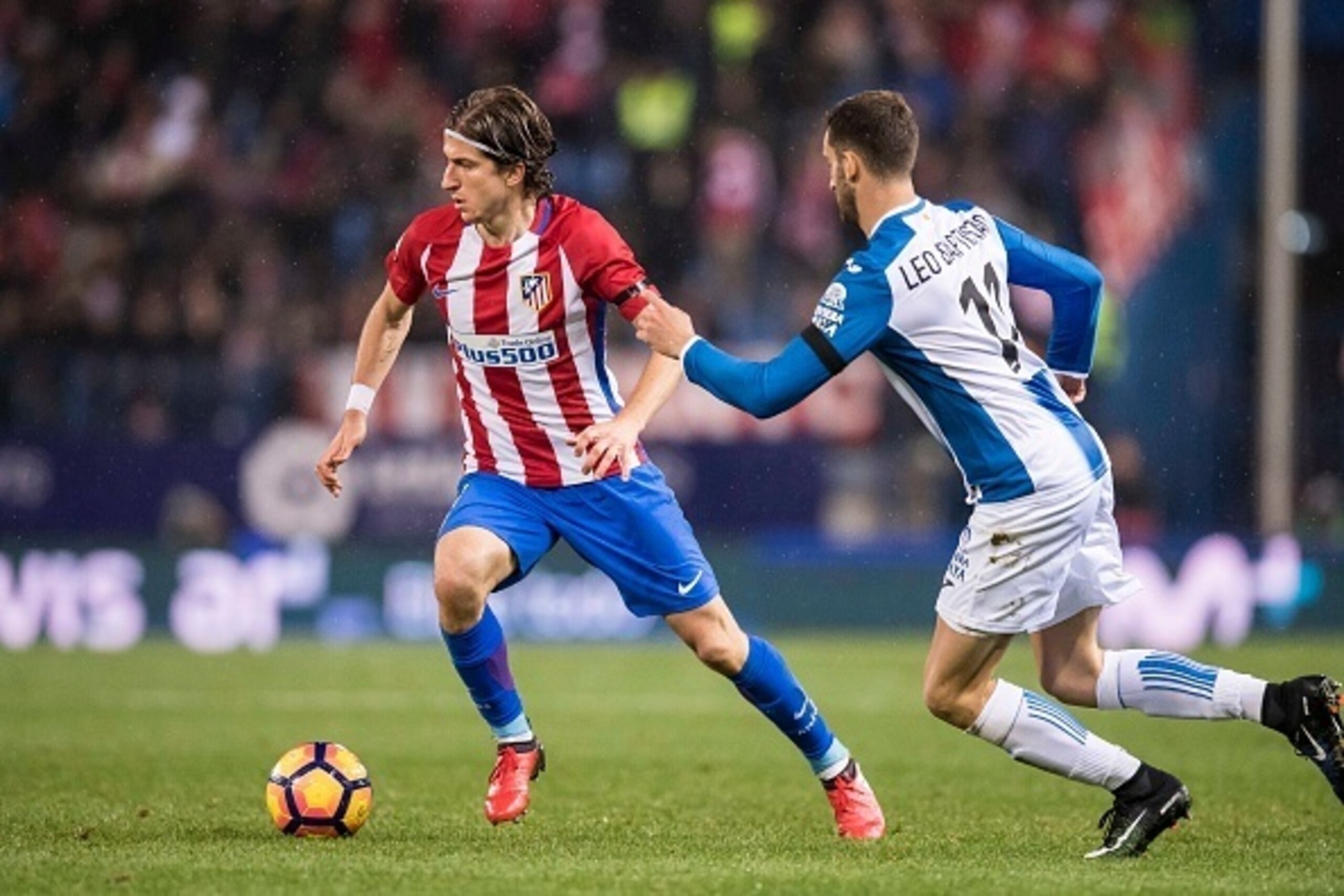 MADRID, SPAIN - DECEMBER 03: Filipe Luis of Atletico de Madrid battles for the ball with Leo Baptistao of RCD Espanyol during the La Liga match between Atletico de Madrid and RCD Espanyol at the Vicente Calderon Stadium on 03 November 2016 in Madrid, Spai