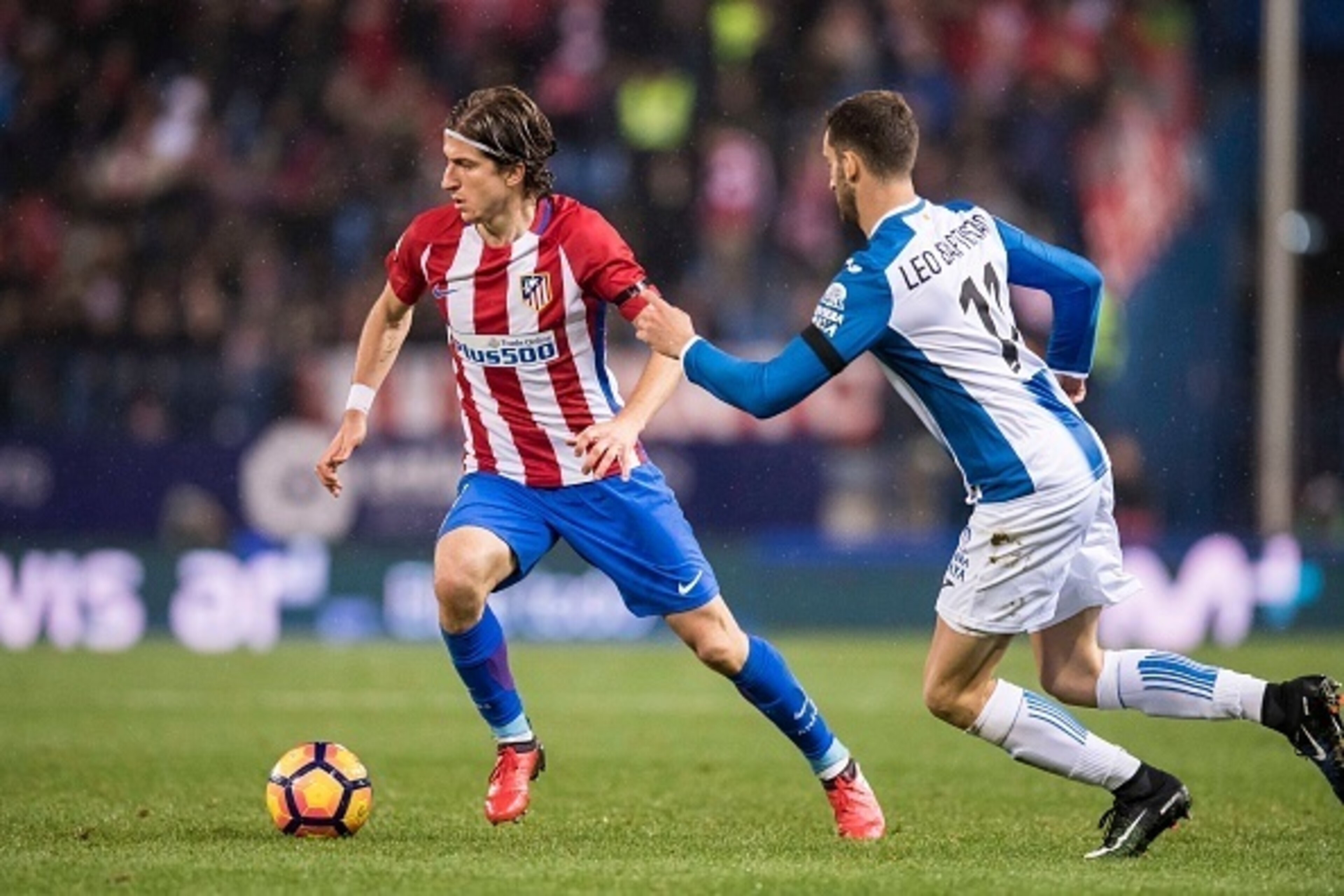 MADRID, SPAIN - DECEMBER 03: Filipe Luis of Atletico de Madrid battles for the ball with Leo Baptistao of RCD Espanyol during the La Liga match between Atletico de Madrid and RCD Espanyol at the Vicente Calderon Stadium on 03 November 2016 in Madrid, Spai MADRID, SPAIN - DECEMBER 03: Filipe Luis of Atletico de Madrid battles for the ball with Leo Baptistao of RCD Espanyol during the La Liga match between Atletico de Madrid and RCD Espanyol at the Vicente Calderon Stadium on 03 November 2016 in Madrid, Spai