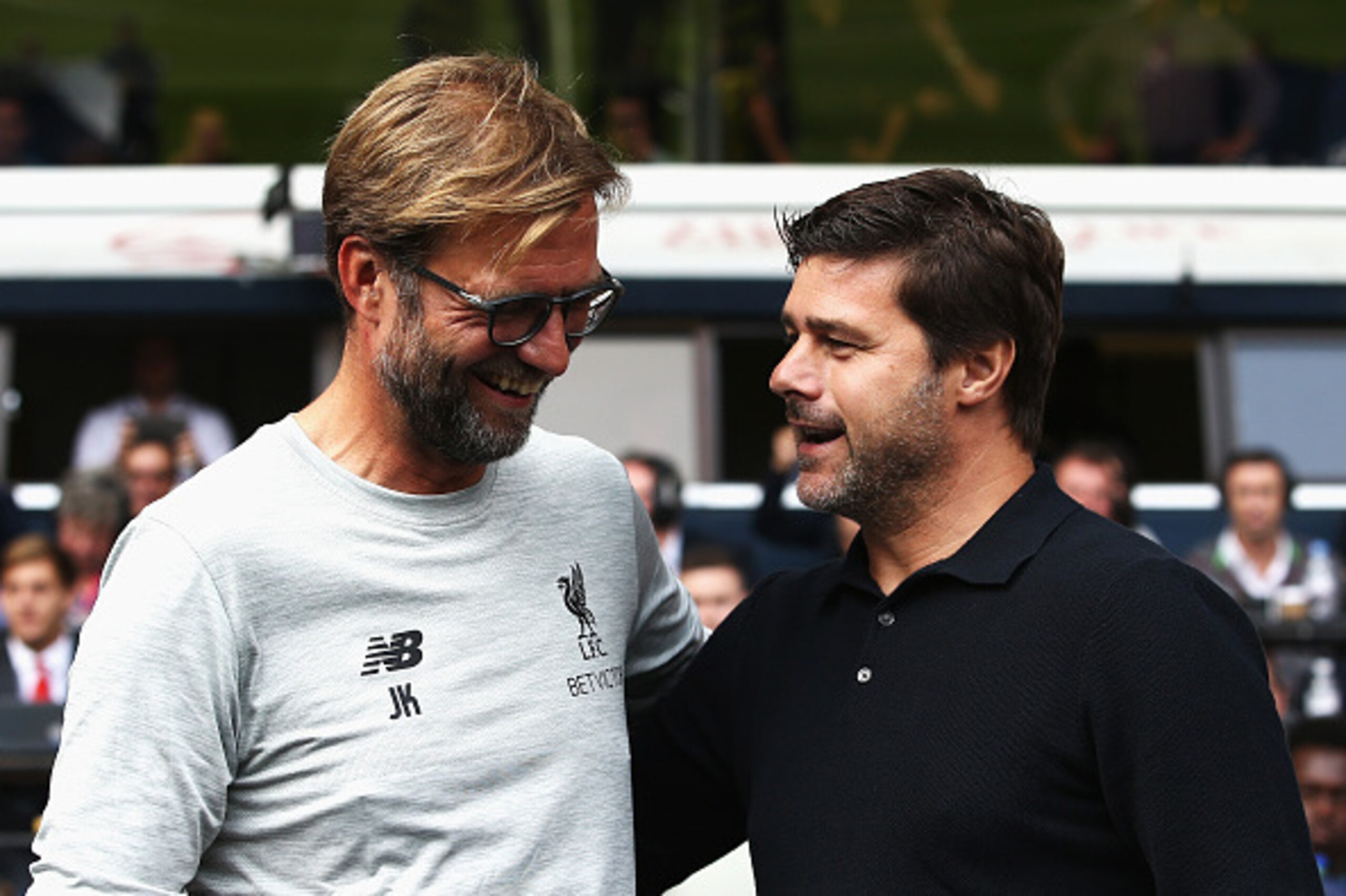 LONDON, ENGLAND - AUGUST 27: Jurgen Klopp, Manager of Liverpool and Mauricio Pochettino, Manager of Tottenham Hotspur exchange words piror to kick off during the Premier League match between Tottenham Hotspur and Liverpool at White Hart Lane on August 27,