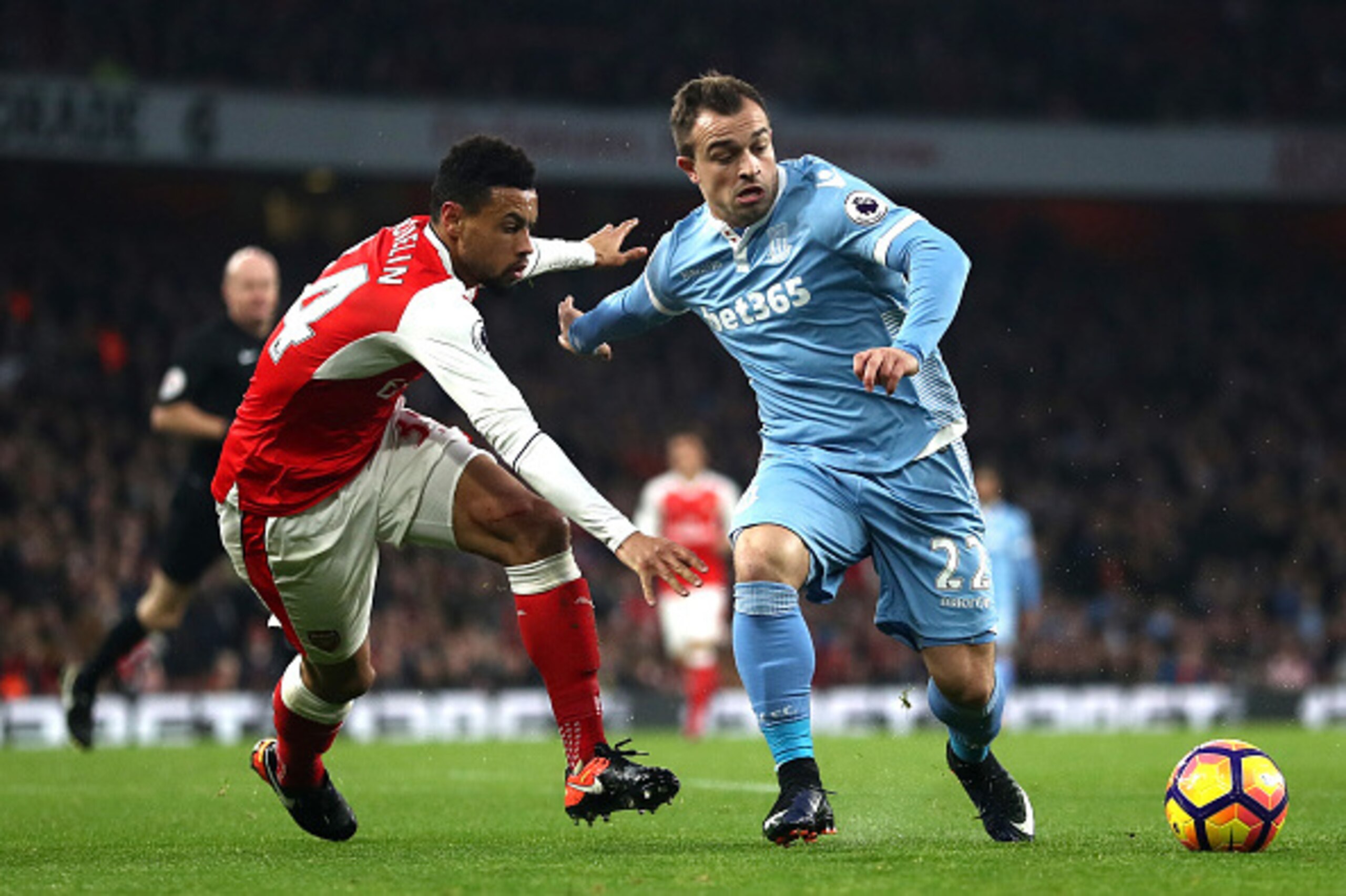 LONDON, ENGLAND - DECEMBER 10: Francis Coquelin of Arsenal (L) and Xherdan Shaqiri of Stoke City (R) battle for possession during the Premier League match between Arsenal and Stoke City at the Emirates Stadium on December 10, 2016 in London, England.  (Ph