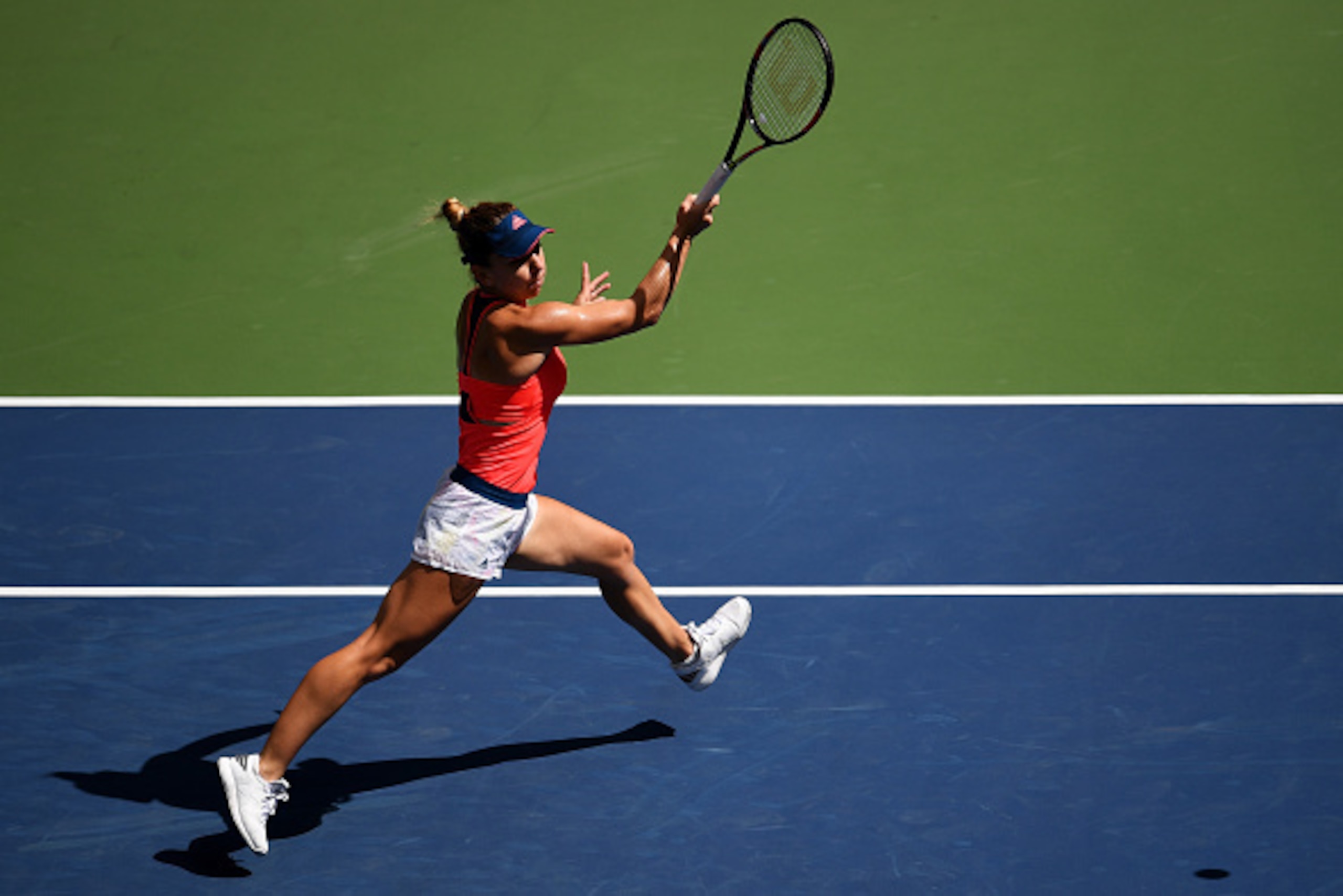 NEW YORK, NY - AUGUST 30:  Simona Halep of Romania returns a shot to Kirsten Flipkens of Belgium during her first round Women's Singles match on Day Two of the 2016 US Open at the USTA Billie Jean King National Tennis Center on August 30, 2016 in the Flus