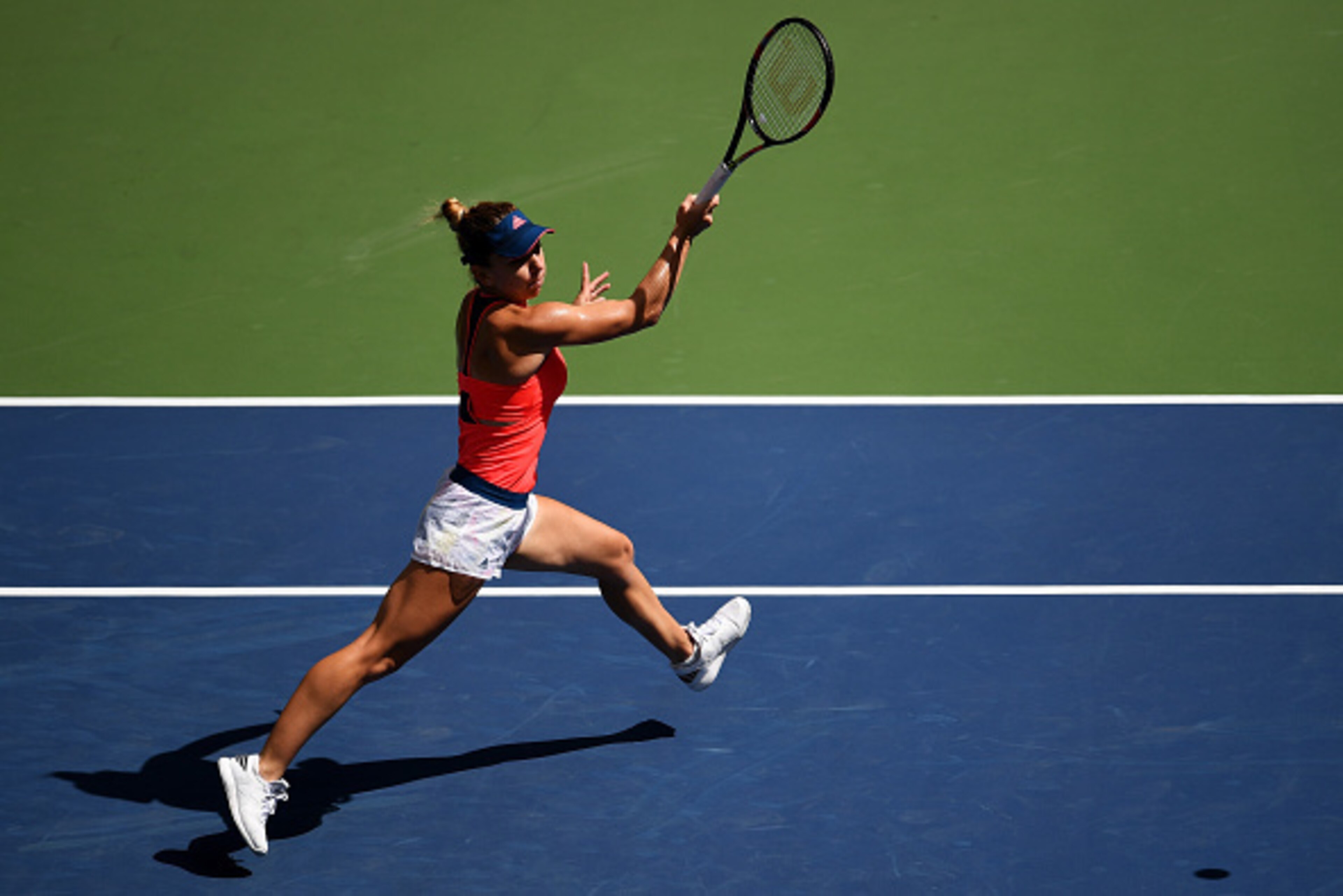 NEW YORK, NY - AUGUST 30:  Simona Halep of Romania returns a shot to Kirsten Flipkens of Belgium during her first round Women's Singles match on Day Two of the 2016 US Open at the USTA Billie Jean King National Tennis Center on August 30, 2016 in the Flus