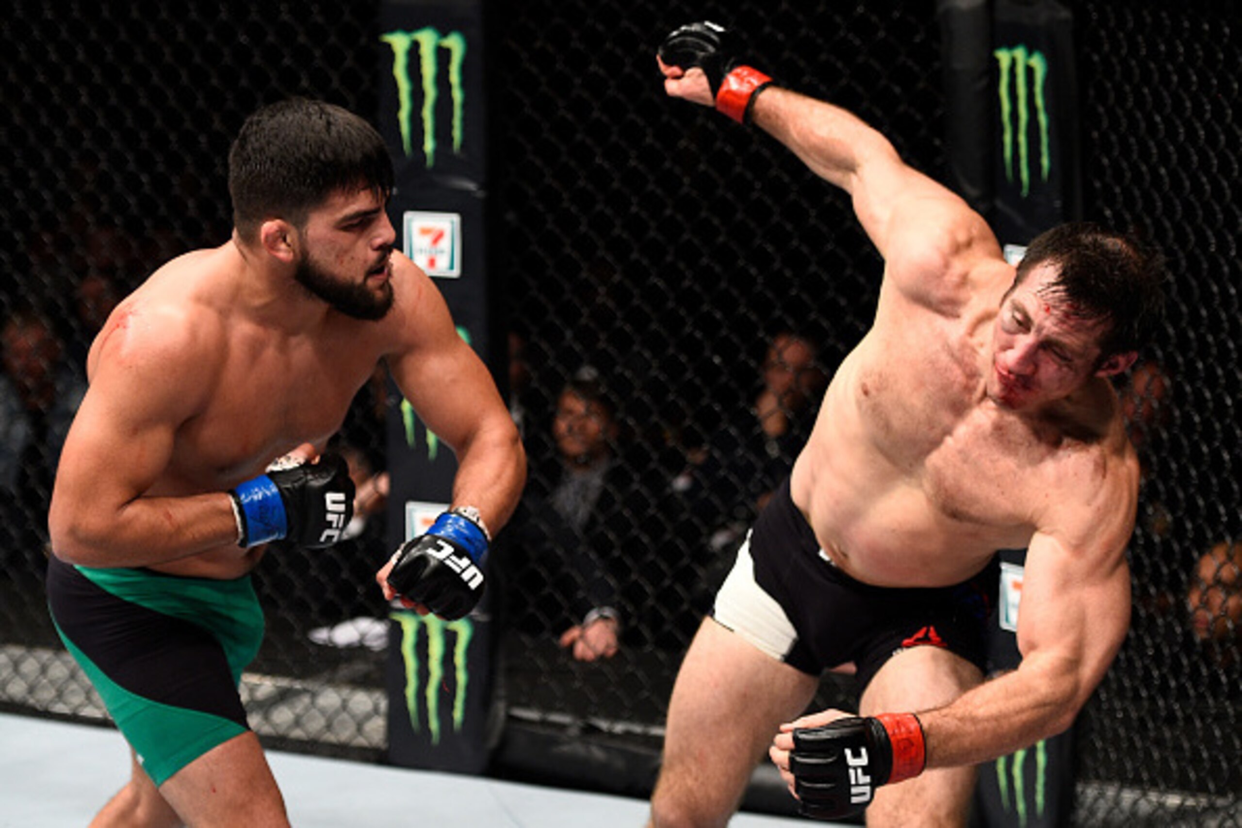 TORONTO, CANADA - DECEMBER 10:  (L-R) Kelvin Gastelum knocks down Tim Kennedy with a punch in their middleweight bout during the UFC 206 event inside the Air Canada Centre on December 10, 2016 in Toronto, Ontario, Canada. (Photo by Jeff Bottari/Zuffa LLC/