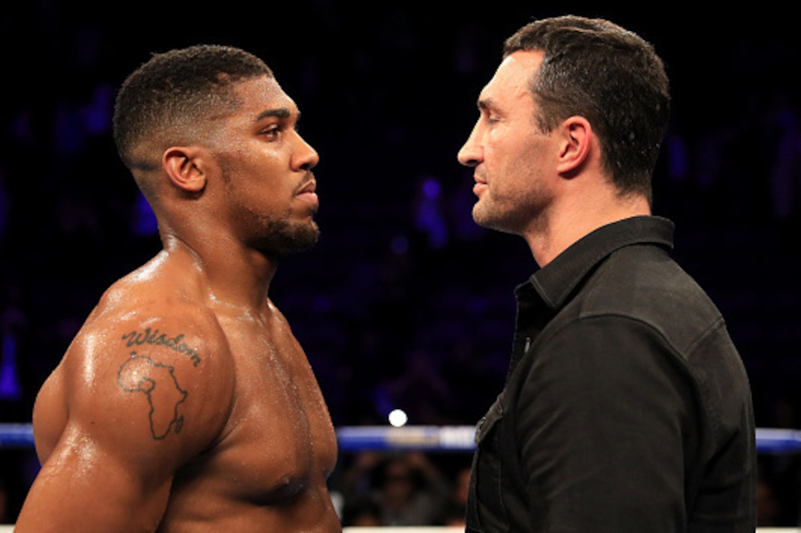 MANCHESTER, ENGLAND - DECEMBER 10: Wladimir Klitschko of Ukraine looks at Anthony Joshua of England (L) following the announcement that the pair will fight at Wembley Stadium in April 2017, at Manchester Arena on December 10, 2016 in Manchester, England. MANCHESTER, ENGLAND - DECEMBER 10: Wladimir Klitschko of Ukraine looks at Anthony Joshua of England (L) following the announcement that the pair will fight at Wembley Stadium in April 2017, at Manchester Arena on December 10, 2016 in Manchester, England.