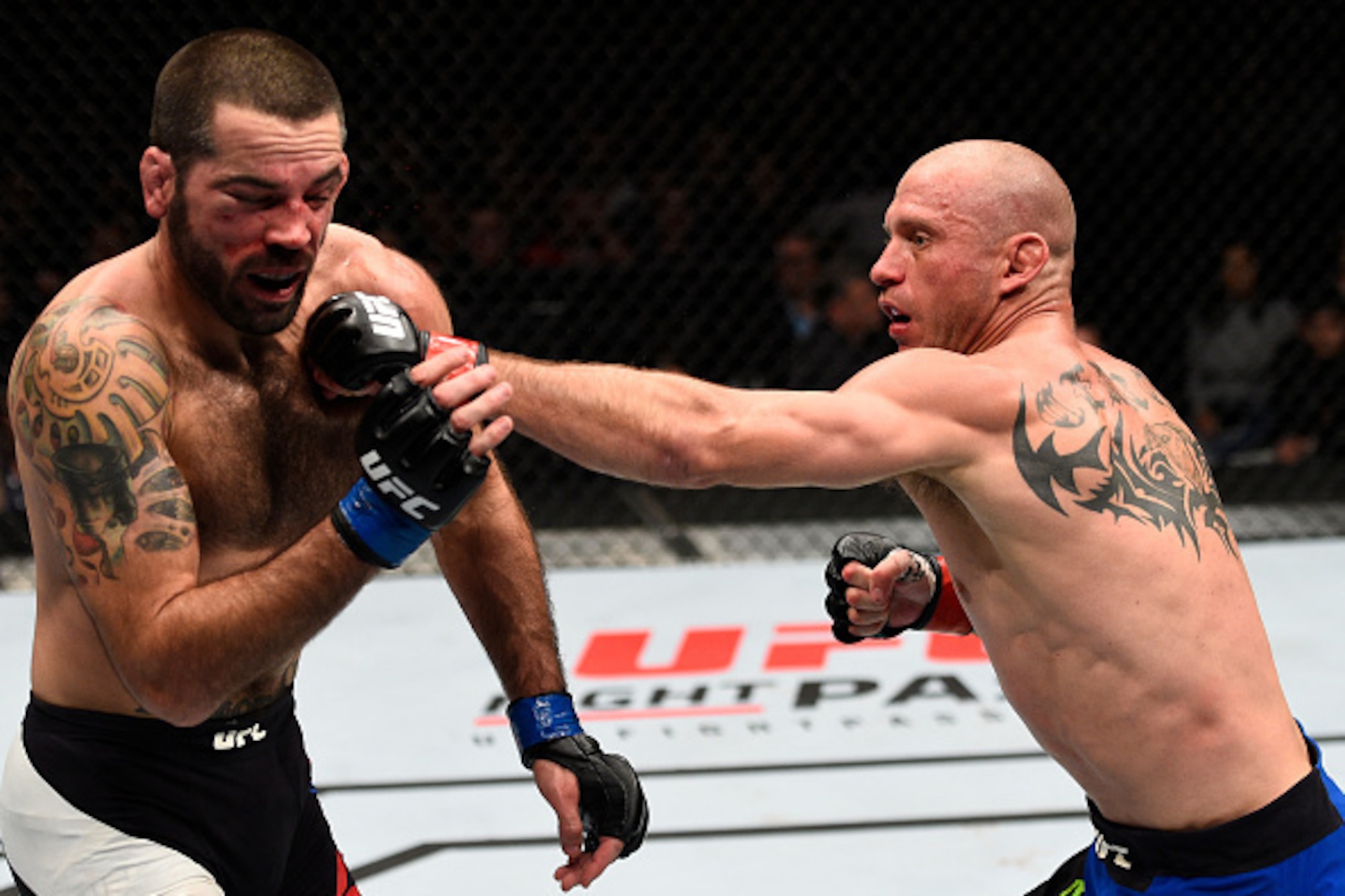 TORONTO, CANADA - DECEMBER 10:  (R-L) Donald Cerrone punches Matt Brown in their welterweight bout during the UFC 206 event inside the Air Canada Centre on December 10, 2016 in Toronto, Ontario, Canada. (Photo by Jeff Bottari/Zuffa LLC/Zuffa LLC via Getty