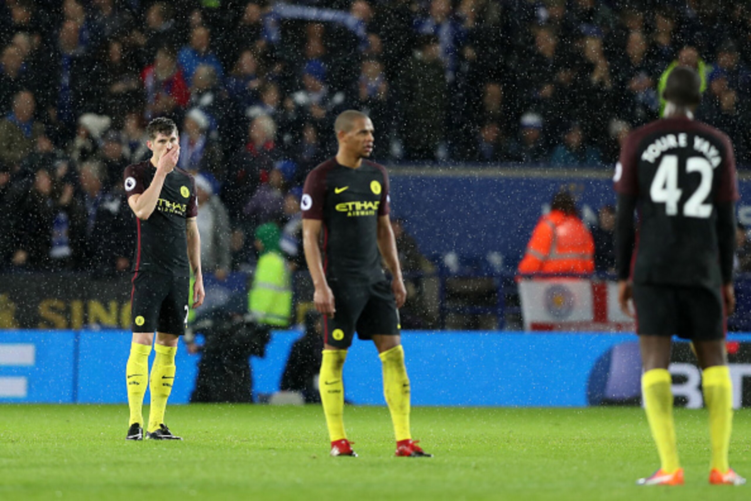 LEICESTER, ENGLAND - DECEMBER 10:  John Stones of Manchester City (L) is djected after Jamie Vardy of Leicester City (not pictured) scored his sides fourth goal during the Premier League match between Leicester City and Manchester City at the King Power S