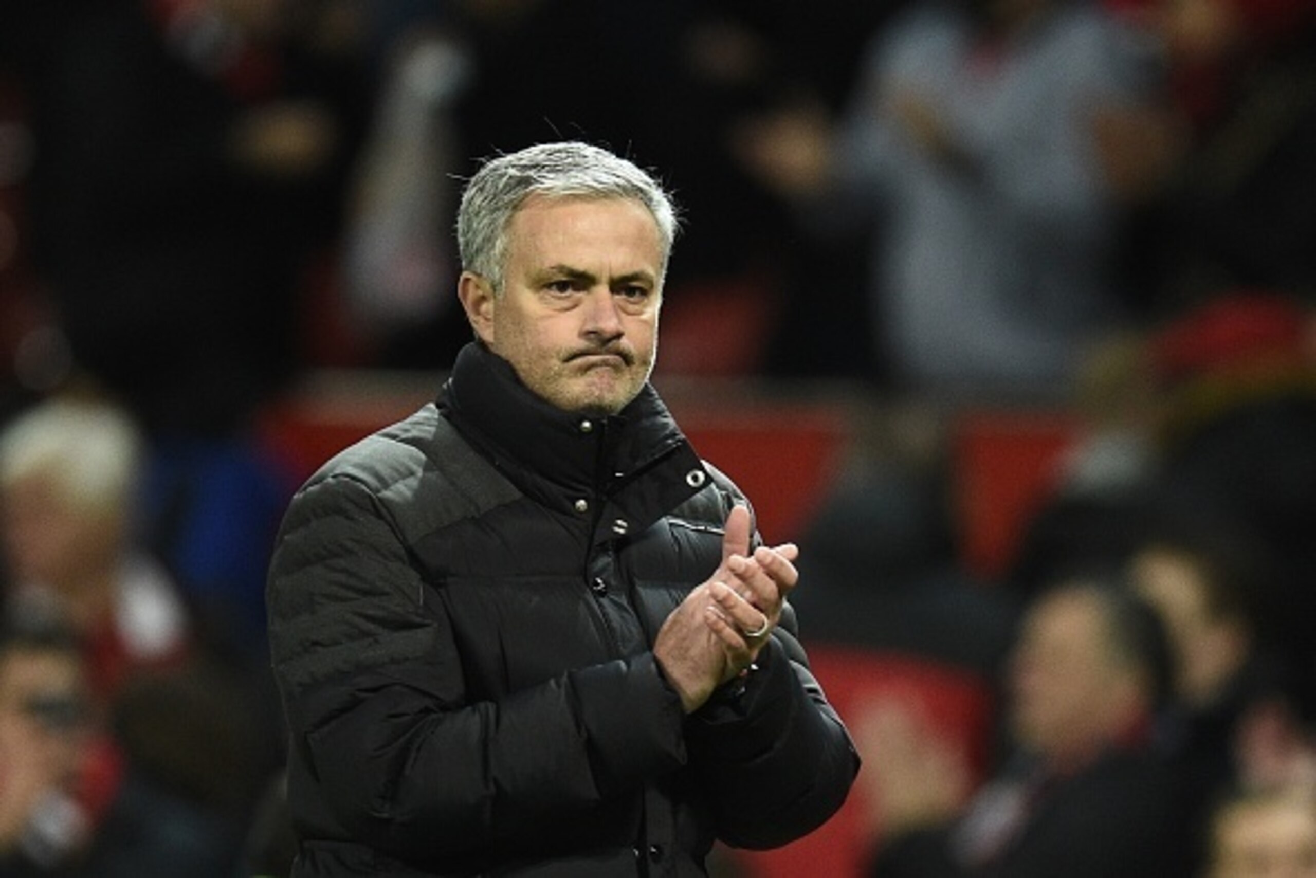 Manchester United's Portuguese manager Jose Mourinho applauds after the English Premier League football match between Manchester United and Tottenham Hotspur at Old Trafford in Manchester, north west England, on December 11, 2016.
Manchester United won th