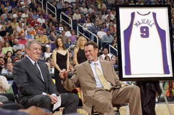 PHOENIX - MARCH 9:  Phoenix Suns owner Jerry Colangelo watches as Dan Majerle is inducted into the Phoenix Suns Ring of Honor before the game between the Minnesota Timberwolves and the Phoenix Suns at America West Arena on March 9, 2003 in Phoenix, Arizon