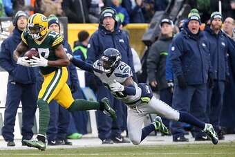 GREEN BAY, WI - DECEMBER 11:  Davante Adams #17 of the Green Bay Packers catches a pass for a touchdown during the game against the Seattle Seahawks at Lambeau Field on December 11, 2016 in Green Bay, Wisconsin.  (Photo by Stacy Revere/Getty Images)