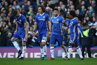 LONDON, ENGLAND - DECEMBER 11: Diego Costa (2nd R) of Chelsea celebrates scoring the opening goal with his team mates Gary Cahill (1st L), David Luiz (2nd L) and Willian (1st R) during the Premier League match between Chelsea and West Bromwich Albion at S