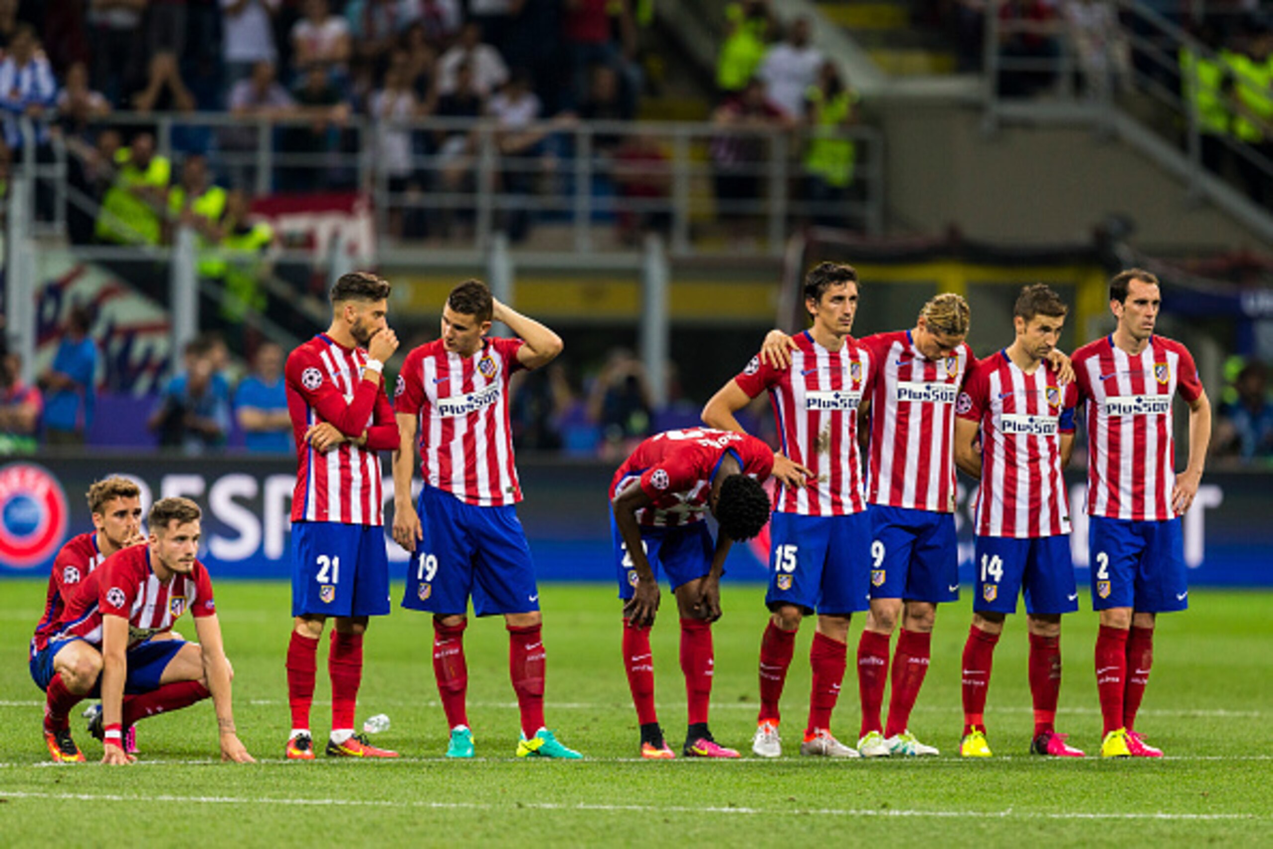 MILAN, ITALY - MAY 28: Atletico Madrid players look on as Juanfran (not pictured) prepares to take a penalty during the UEFA Champions League Final between Real Madrid and Atletico Madrid at Stadio Giuseppe Meazza on May 28, 2016 in Milan, Italy. (Photo b