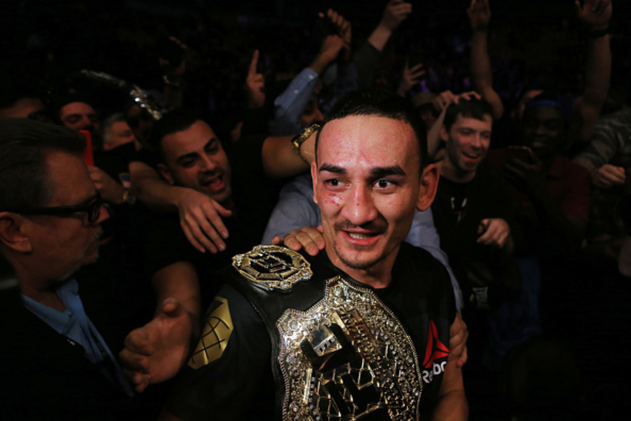 TORONTO, ON - DECEMBER 10:  Max Holloway of the United States defeats Anthony Pettis of the United States for the Interim Featherweight Title during the UFC 206 event at Air Canada Centre on December 10, 2016 in Toronto, Canada.  (Photo by Vaughn Ridley/G