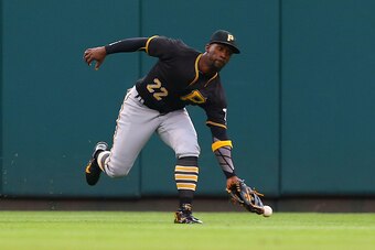 ST. LOUIS, MO - OCTOBER 2: Andrew McCutchen #22 of the Pittsburgh Pirates misplays a fly ball against the St. Louis Cardinals in the third inning at Busch Stadium on October 2, 2016 in St. Louis, Missouri.  (Photo by Dilip Vishwanat/Getty Images)
