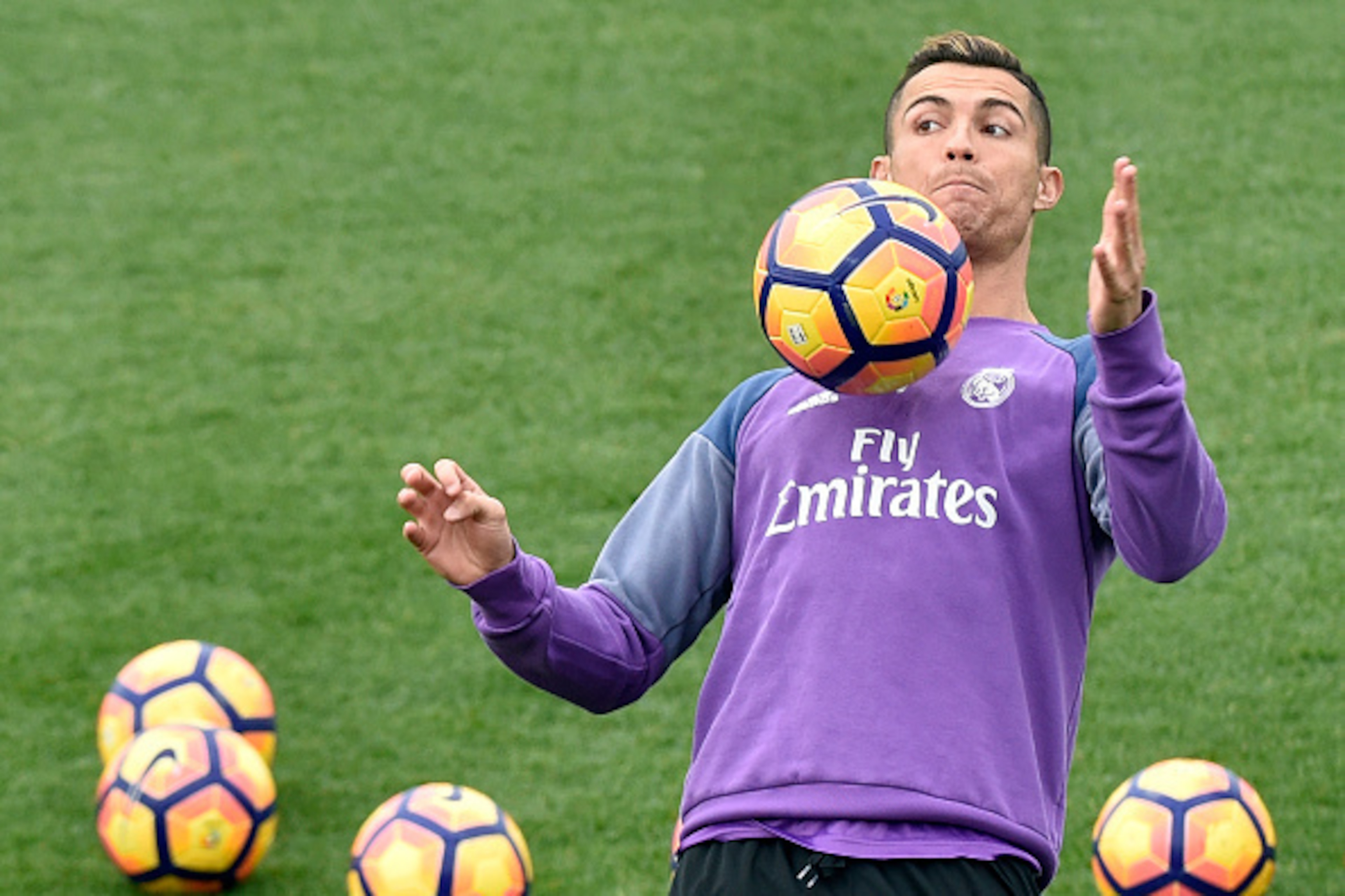 Real Madrid's Portuguese forward Cristiano Ronaldo controls a ball during a training session at Valdebebas training ground in Madrid on December 9, 2016, on the eve of the Spanish League match Real Madrid CF vs RC Deportivo de La Coruña. / AFP / GERARD JU