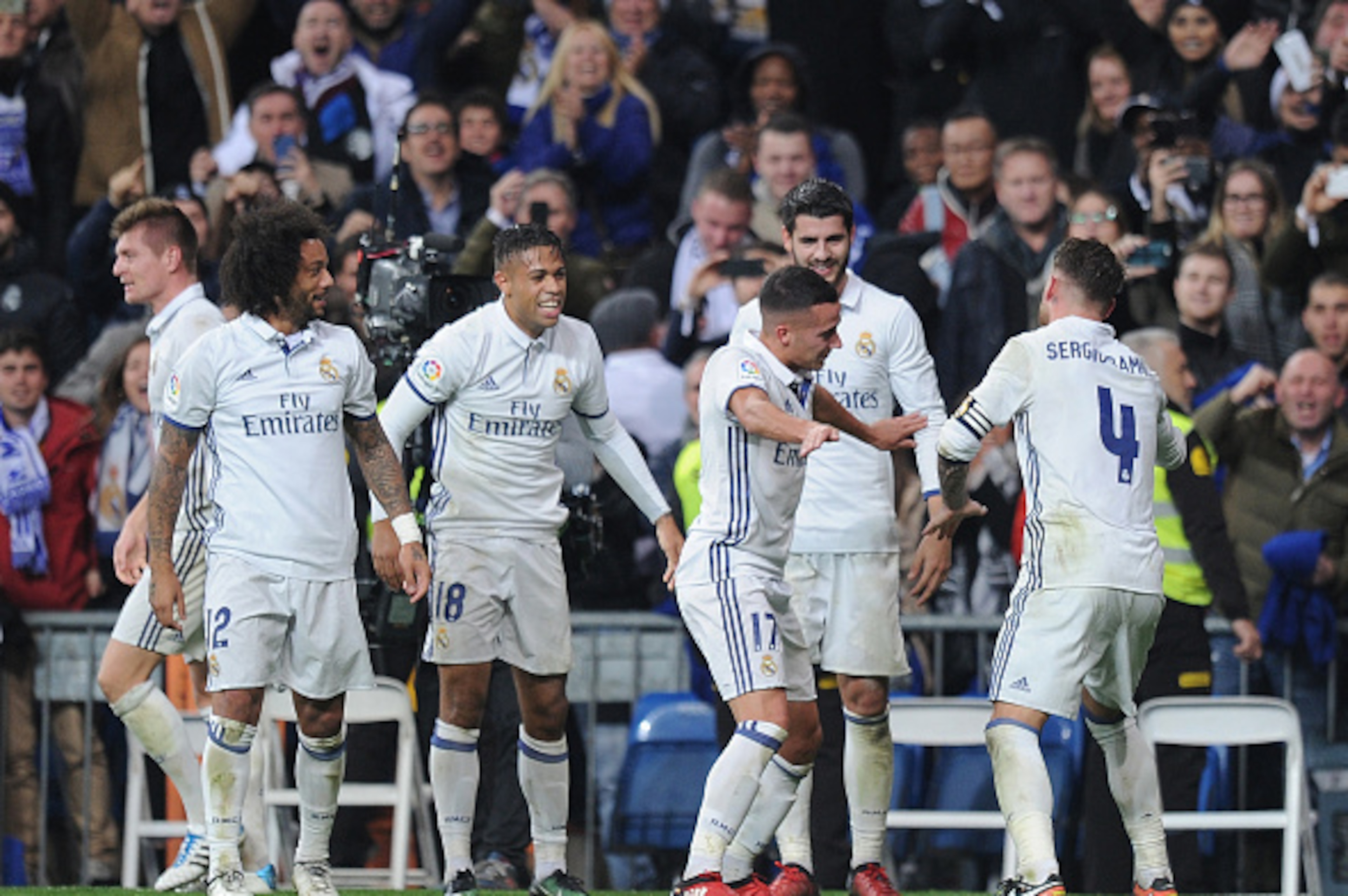 MADRID, SPAIN - DECEMBER 10:  Sergio Ramos of Real Madrid celebrates with teammates after scoring their 3rd goal during the La Liga match between Real Madrid CF and RC Deportivo La Coruna at Estadio Santiago Bernabeu on December 10, 2016 in Madrid, Spain.