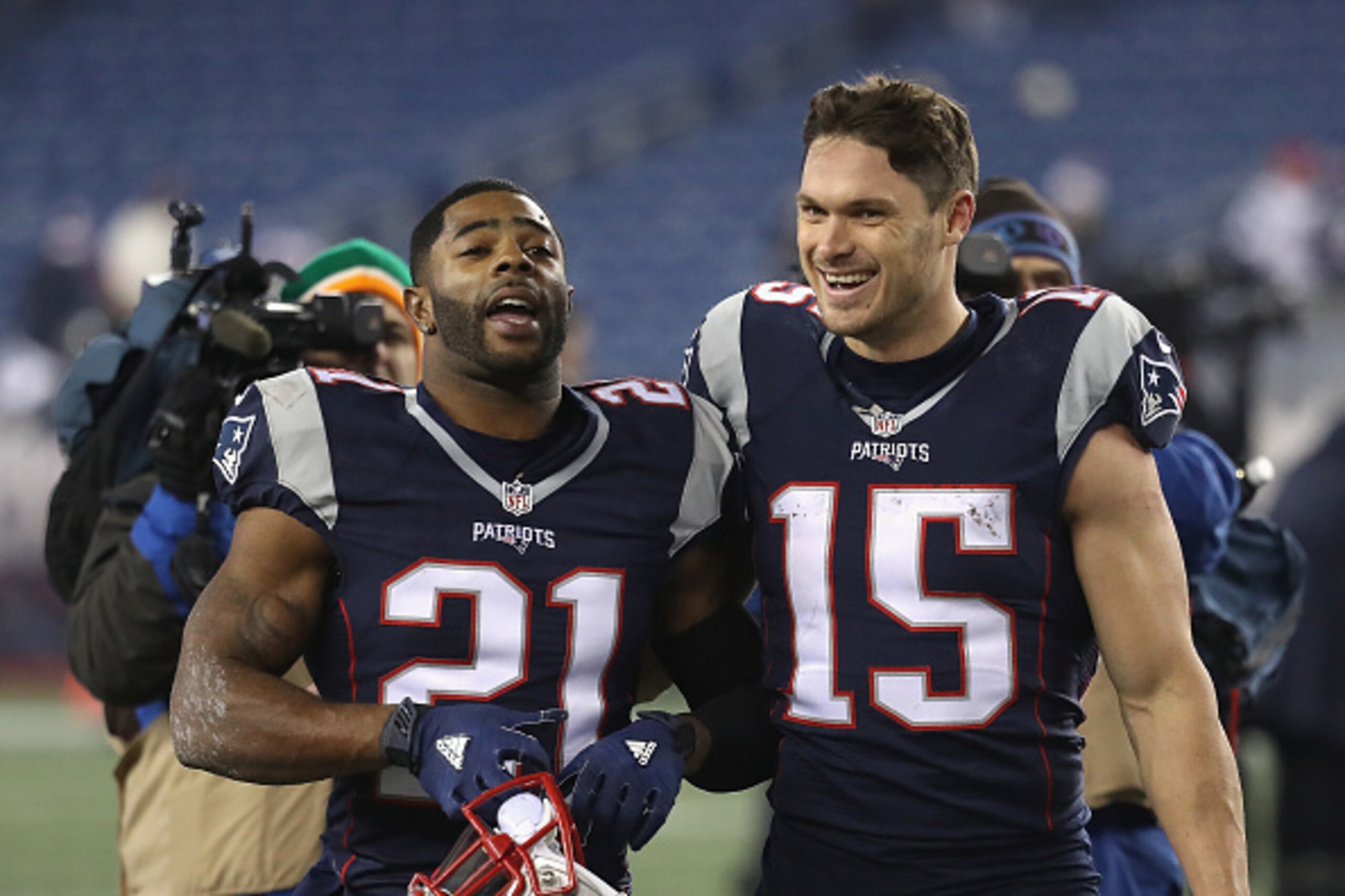 FOXBORO, MA - DECEMBER 12:  Malcolm Butler #21 and Chris Hogan #15 of the New England Patriots react as they walk off the field after defeating the Baltimore Ravens 30-23 at Gillette Stadium on December 12, 2016 in Foxboro, Massachusetts.  (Photo by Rob C