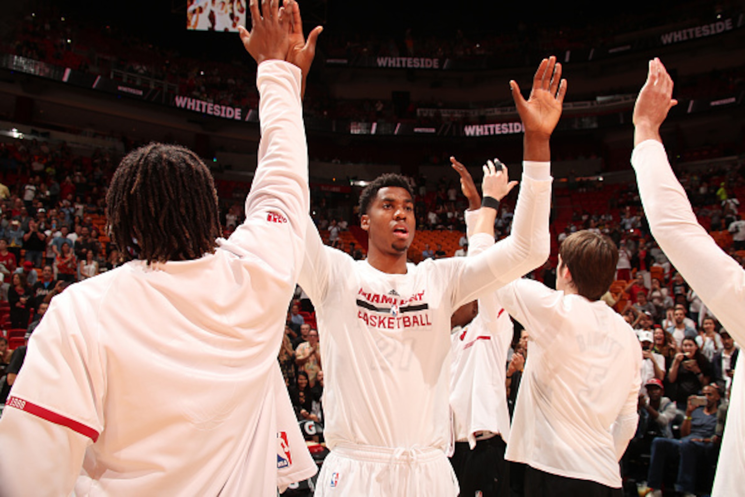 MIAMI, FL - DECEMBER 12:  Hassan Whiteside #21 of the Miami Heat is introduced before a game against the Washington Wizards on December 12, 2016 at American Airlines Arena in Miami, Florida. NOTE TO USER: User expressly acknowledges and agrees that, by do