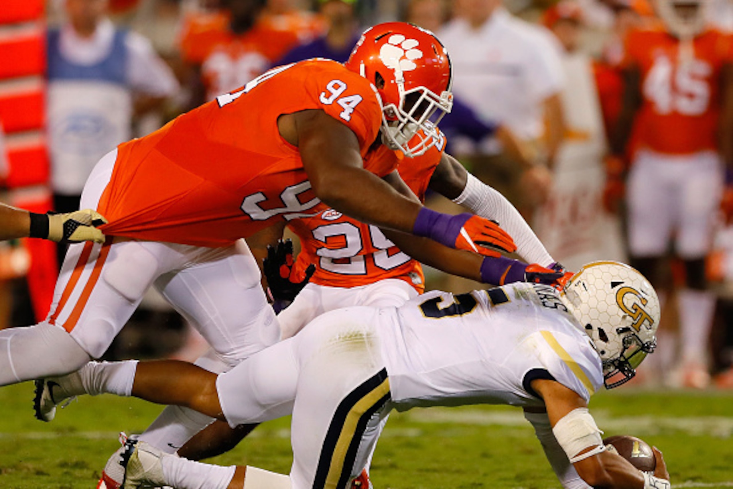 ATLANTA, GA - SEPTEMBER 22:  Justin Thomas #5 of the Georgia Tech Yellow Jackets dives to the ground as his is sacked by Carlos Watkins #94 of the Clemson Tigers at Bobby Dodd Stadium on September 22, 2016 in Atlanta, Georgia.  (Photo by Kevin C. Cox/Gett
