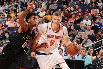 PHOENIX, AZ - DECEMBER 13:  Kristaps Porzingis #6 of the New York Knicks drives to the basket during a game against the Phoenix Suns on December 13, 2016 at Talking Stick Resort Arena in Phoenix, Arizona. NOTE TO USER: User expressly acknowledges and agre
