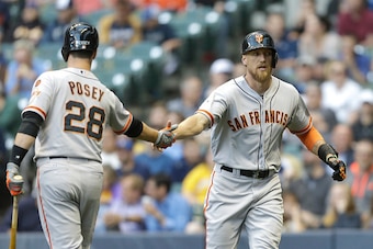MILWAUKEE, WI - MAY 26: Hunter Pence #8 of the San Francisco Giants celebrates with Buster Posey #28 after hitting a solo home run in the first inning against the Milwaukee Brewers at Miller Park on May 26, 2015 in Milwaukee, Wisconsin. (Photo by Mike McG