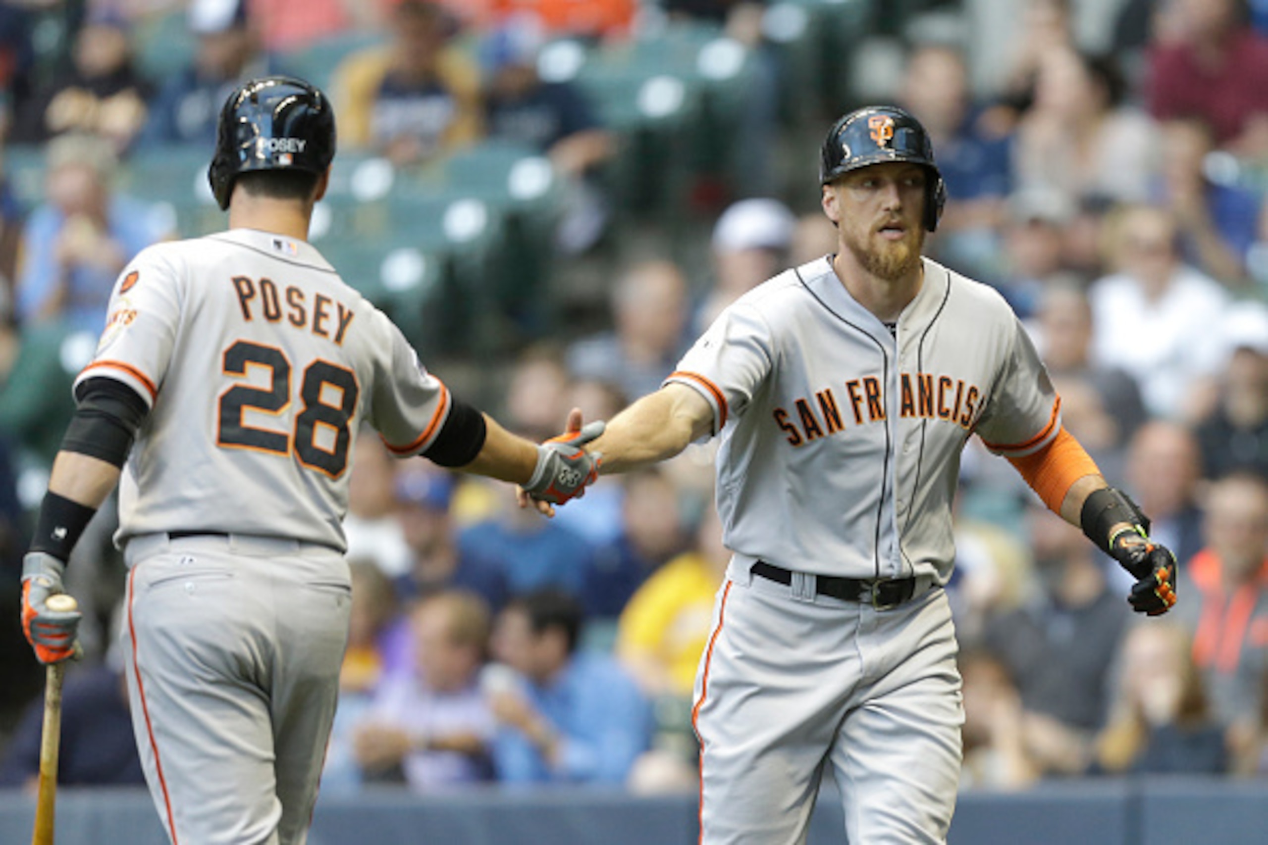 MILWAUKEE, WI - MAY 26: Hunter Pence #8 of the San Francisco Giants celebrates with Buster Posey #28 after hitting a solo home run in the first inning against the Milwaukee Brewers at Miller Park on May 26, 2015 in Milwaukee, Wisconsin. (Photo by Mike McG MILWAUKEE, WI - MAY 26: Hunter Pence #8 of the San Francisco Giants celebrates with Buster Posey #28 after hitting a solo home run in the first inning against the Milwaukee Brewers at Miller Park on May 26, 2015 in Milwaukee, Wisconsin. (Photo by Mike McG