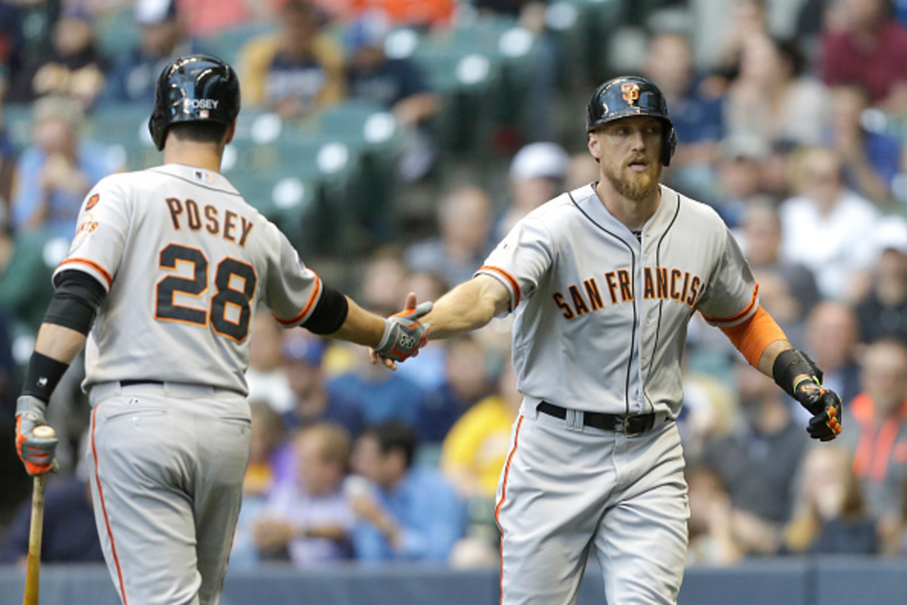 MILWAUKEE, WI - MAY 26: Hunter Pence #8 of the San Francisco Giants celebrates with Buster Posey #28 after hitting a solo home run in the first inning against the Milwaukee Brewers at Miller Park on May 26, 2015 in Milwaukee, Wisconsin. (Photo by Mike McG
