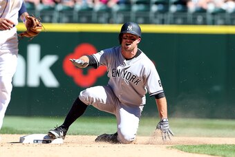 SEATTLE - AUGUST 24:  Brett Gardner #11 of the New York Yankees slides into second base during the game against the Seattle Mariners at Safeco Field on August 24, 2016 in Seattle, Washington.  The Yankees defeated the Mariners 5-0.  (Photo by Rob Leiter/M