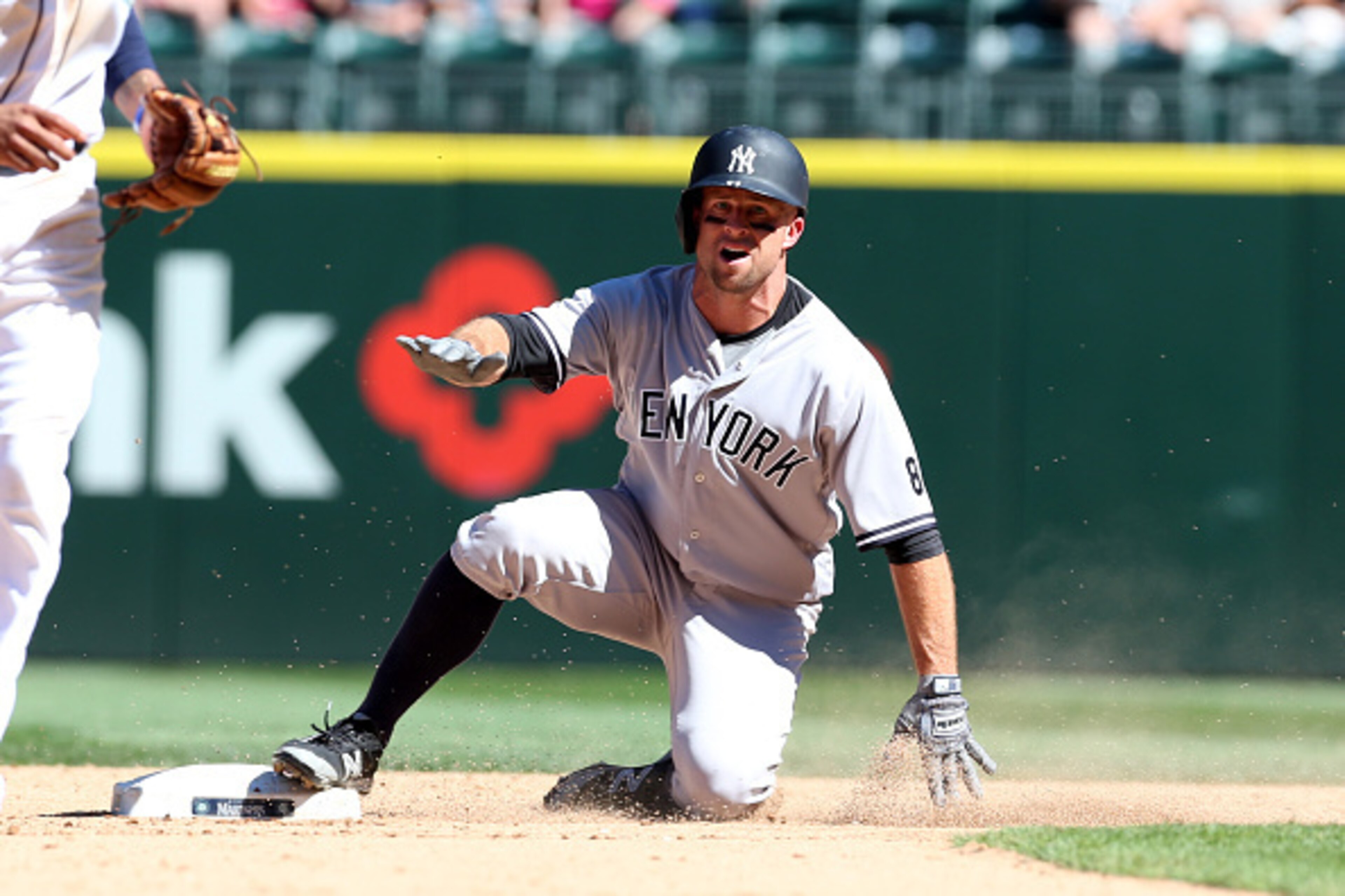 SEATTLE - AUGUST 24:  Brett Gardner #11 of the New York Yankees slides into second base during the game against the Seattle Mariners at Safeco Field on August 24, 2016 in Seattle, Washington.  The Yankees defeated the Mariners 5-0.  (Photo by Rob Leiter/M